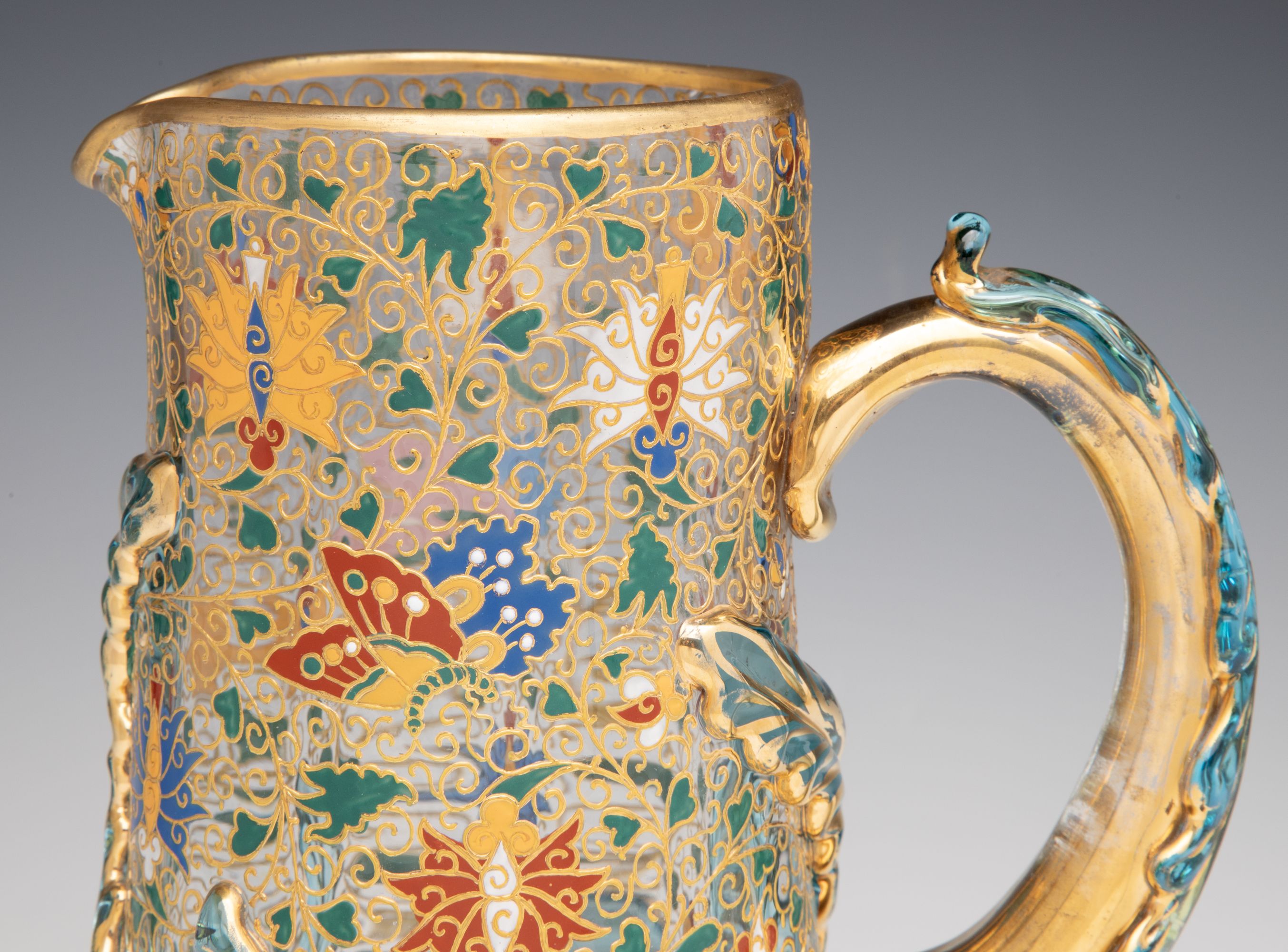 UNUSUAL GILT AND ENAMEL MOSER JUG WITH APPLIED LEAVES