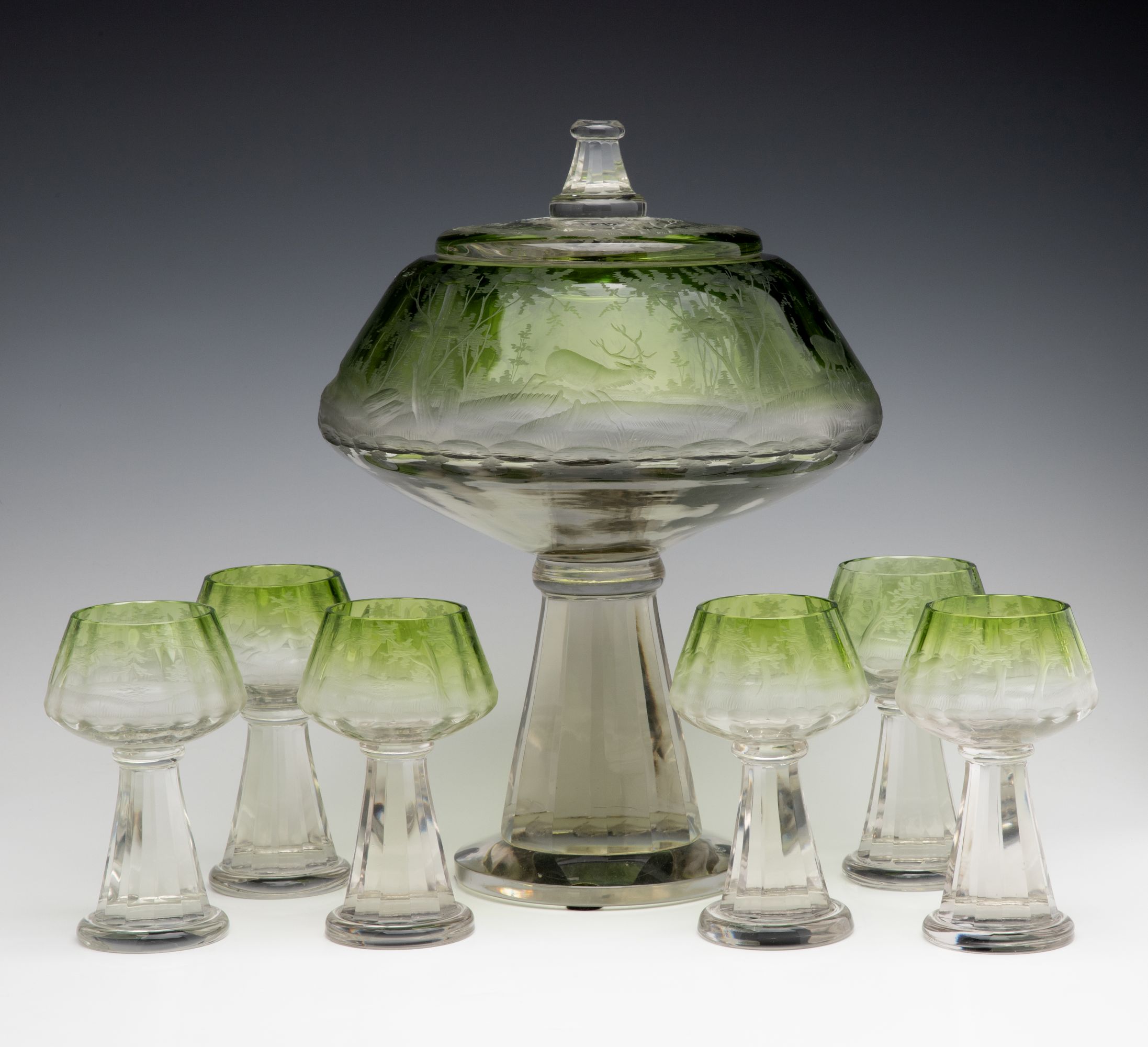 A VERY UNUSUAL BOHEMIAN GLASS PUNCH BOWL WITH GOBLETS