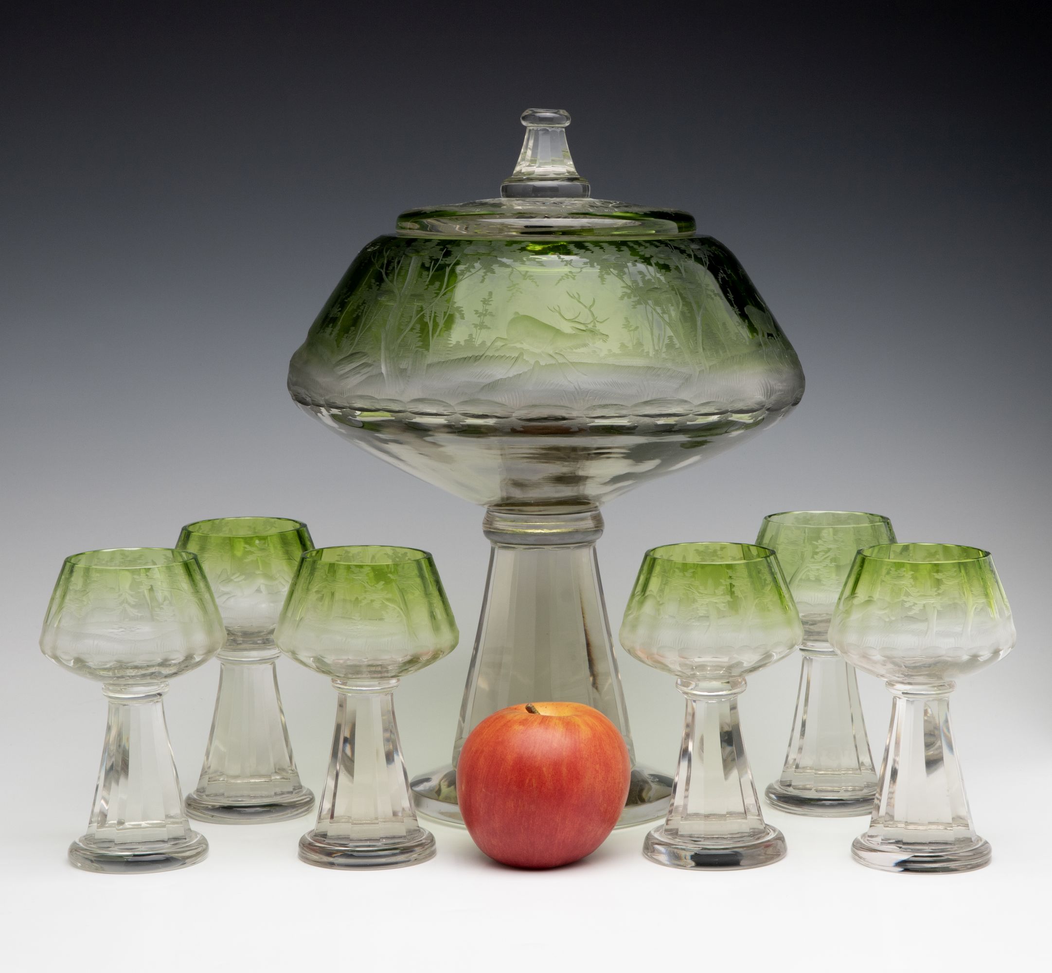 A VERY UNUSUAL BOHEMIAN GLASS PUNCH BOWL WITH GOBLETS