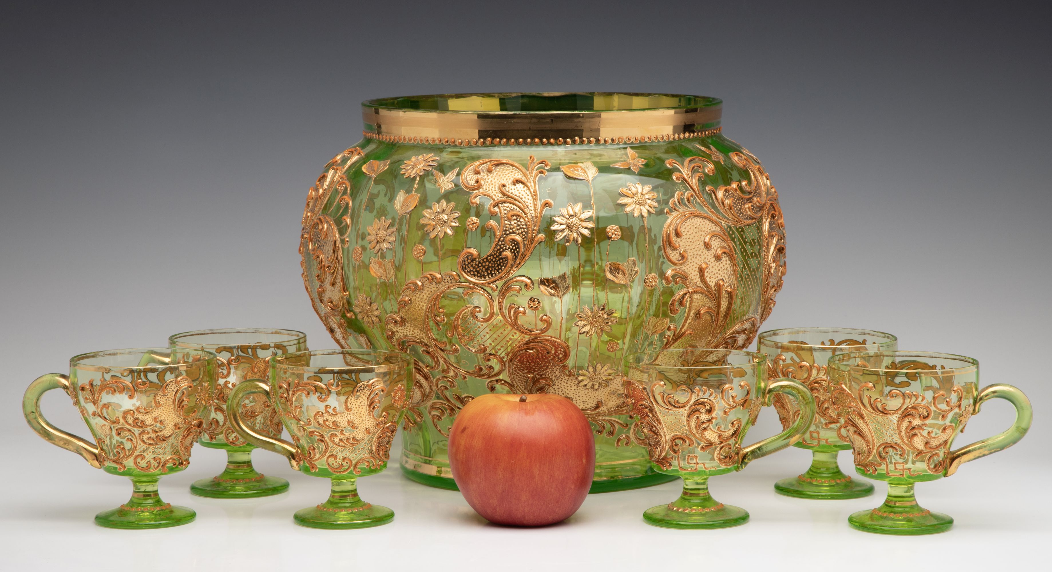 A BOHEMIAN GLASS PUNCH BOWL AND CUPS WITH THICK ENAMELS