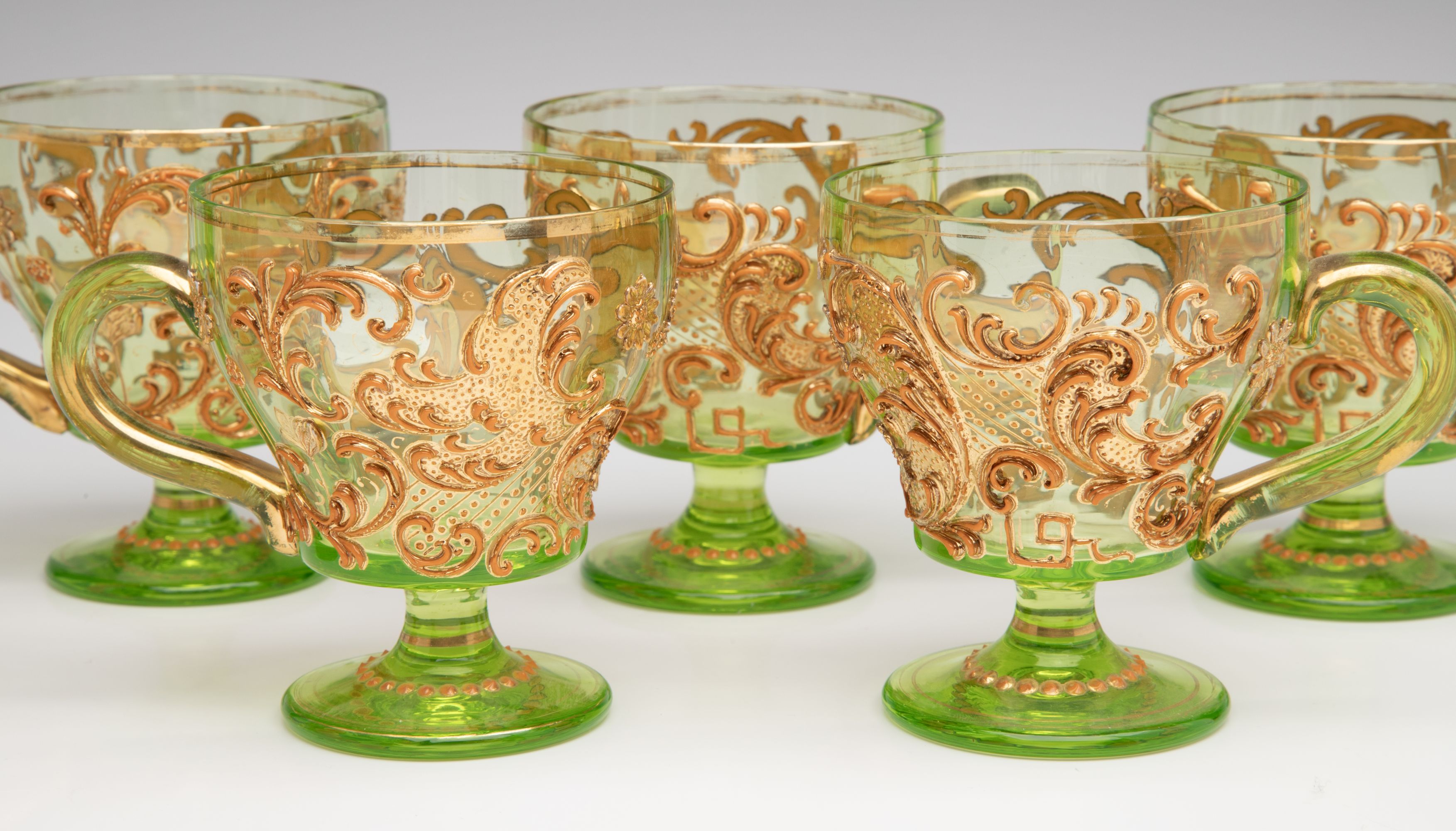 A BOHEMIAN GLASS PUNCH BOWL AND CUPS WITH THICK ENAMELS