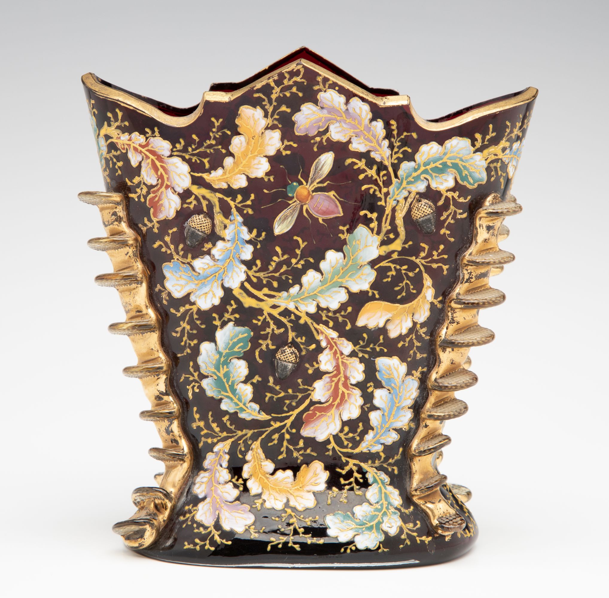 A MOSER DARK RUBY CABINET VASE WITH ACORNS AND RIGAREE