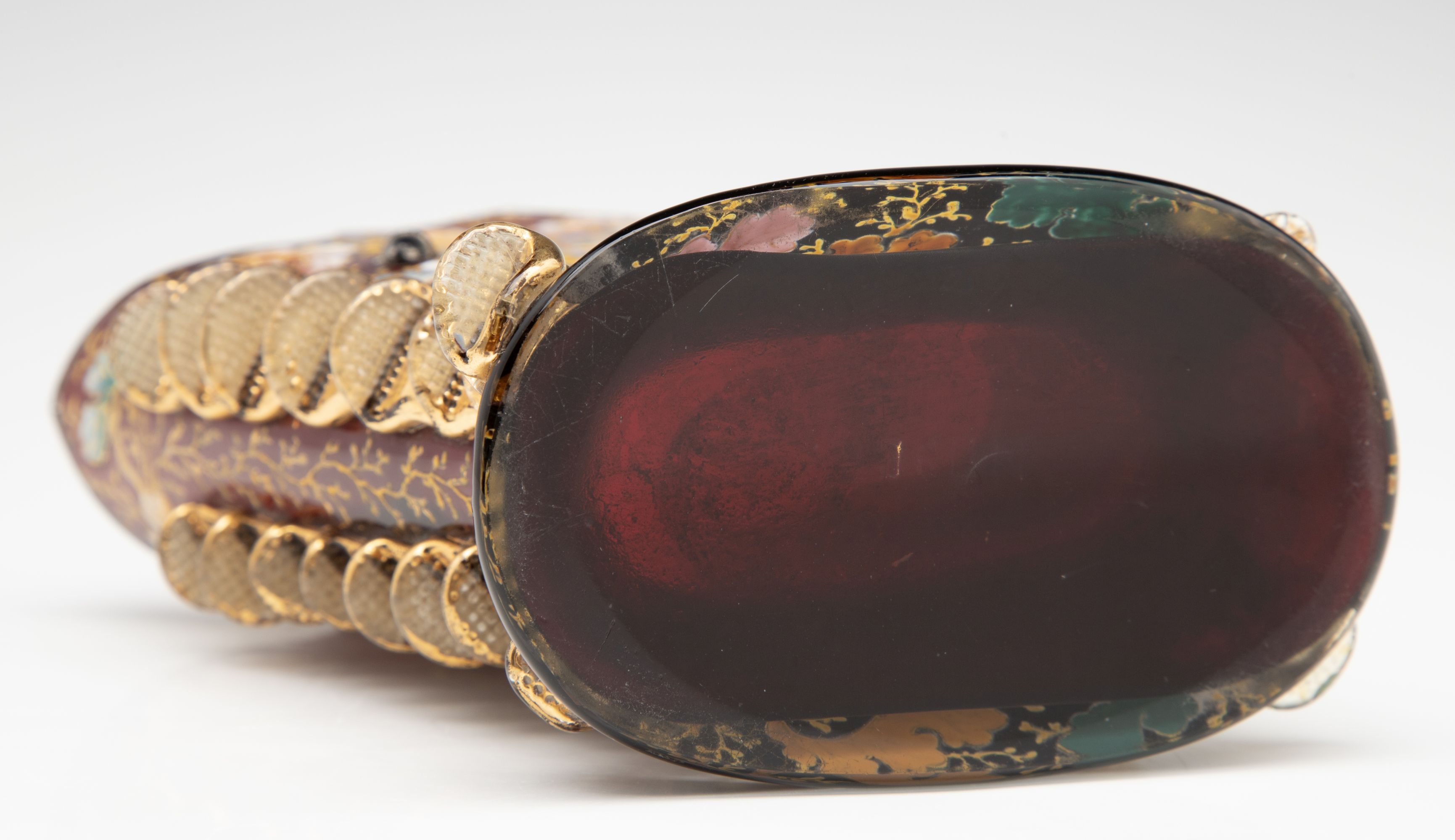 A MOSER DARK RUBY CABINET VASE WITH ACORNS AND RIGAREE