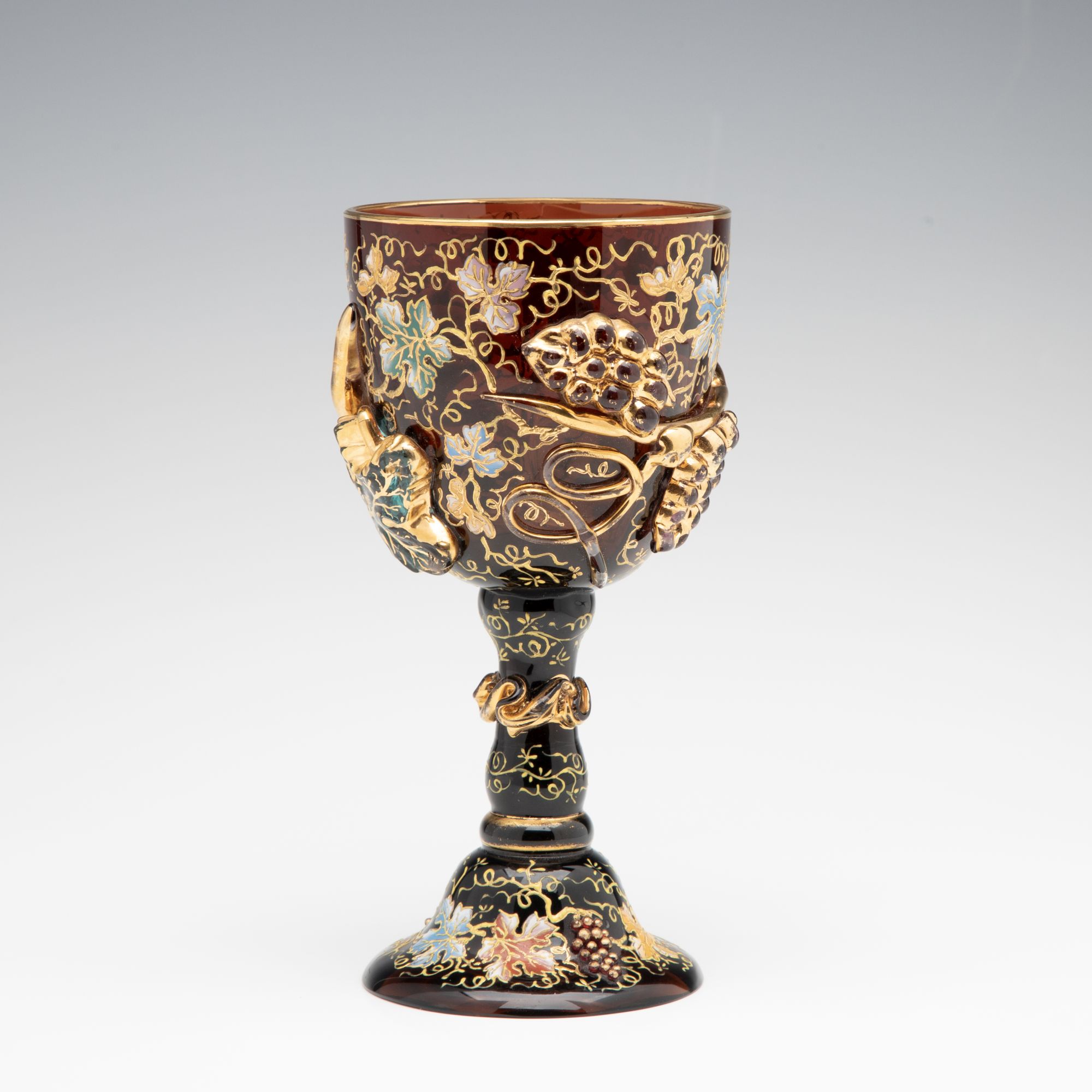 A MOSER DARK AMBERINA GOBLET WITH THICK APPLICATIONS