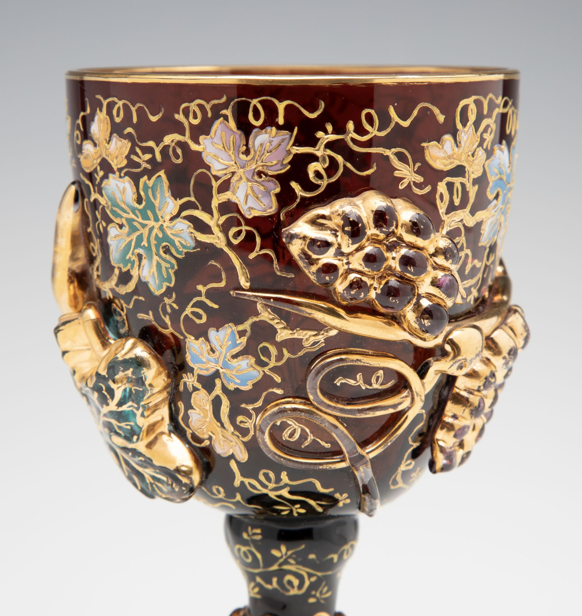 A MOSER DARK AMBERINA GOBLET WITH THICK APPLICATIONS