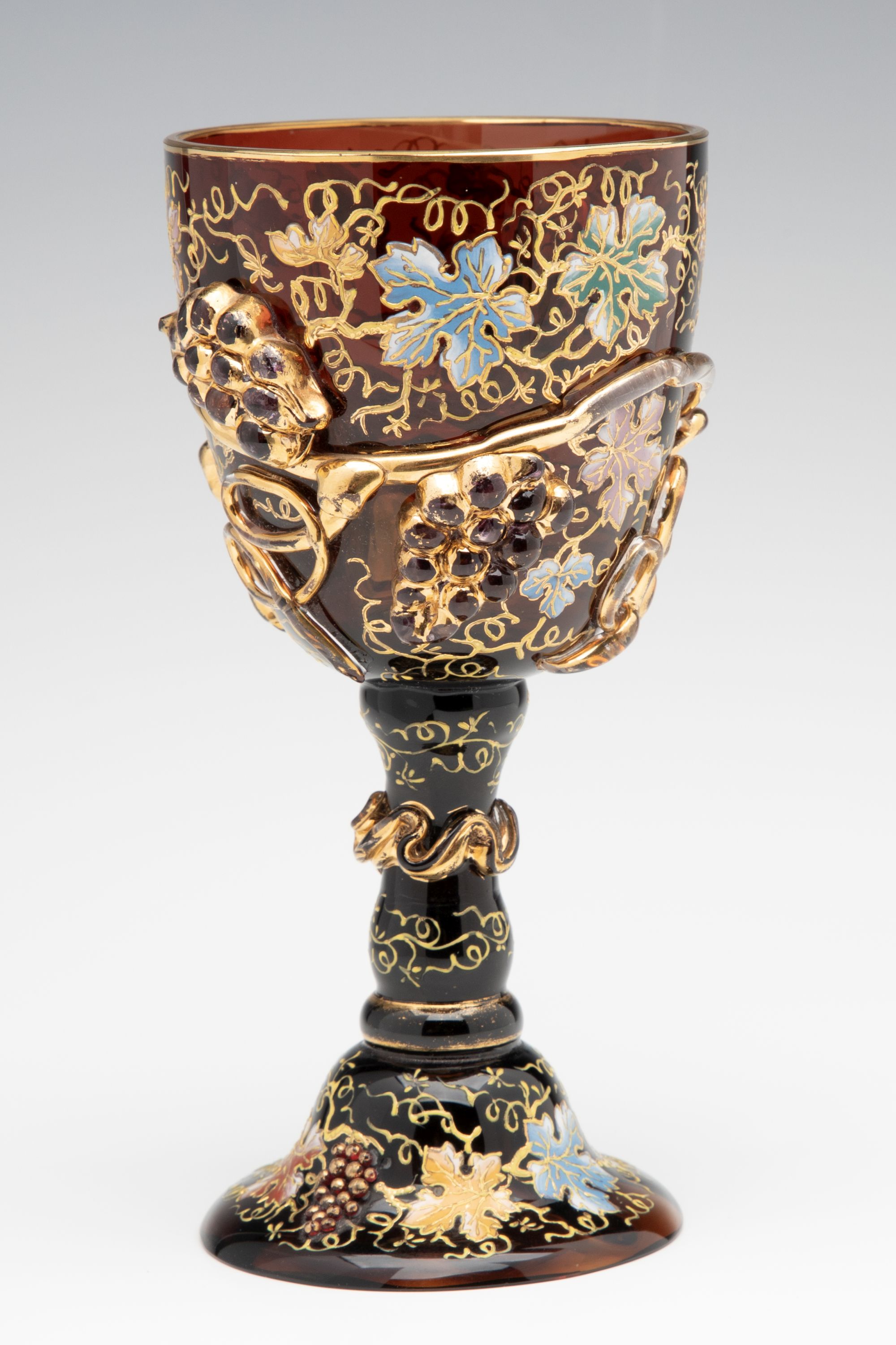 A MOSER DARK AMBERINA GOBLET WITH THICK APPLICATIONS