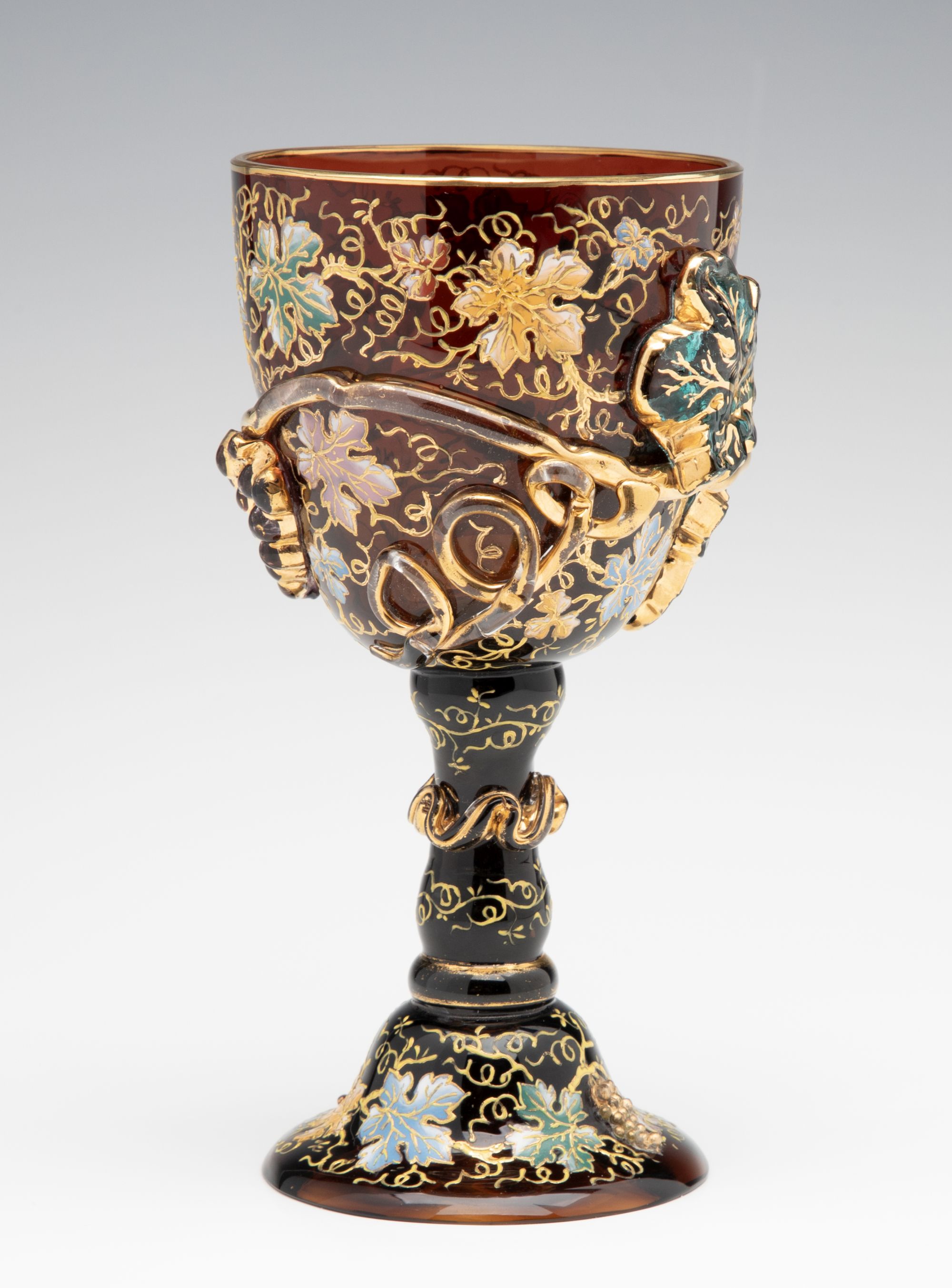 A MOSER DARK AMBERINA GOBLET WITH THICK APPLICATIONS