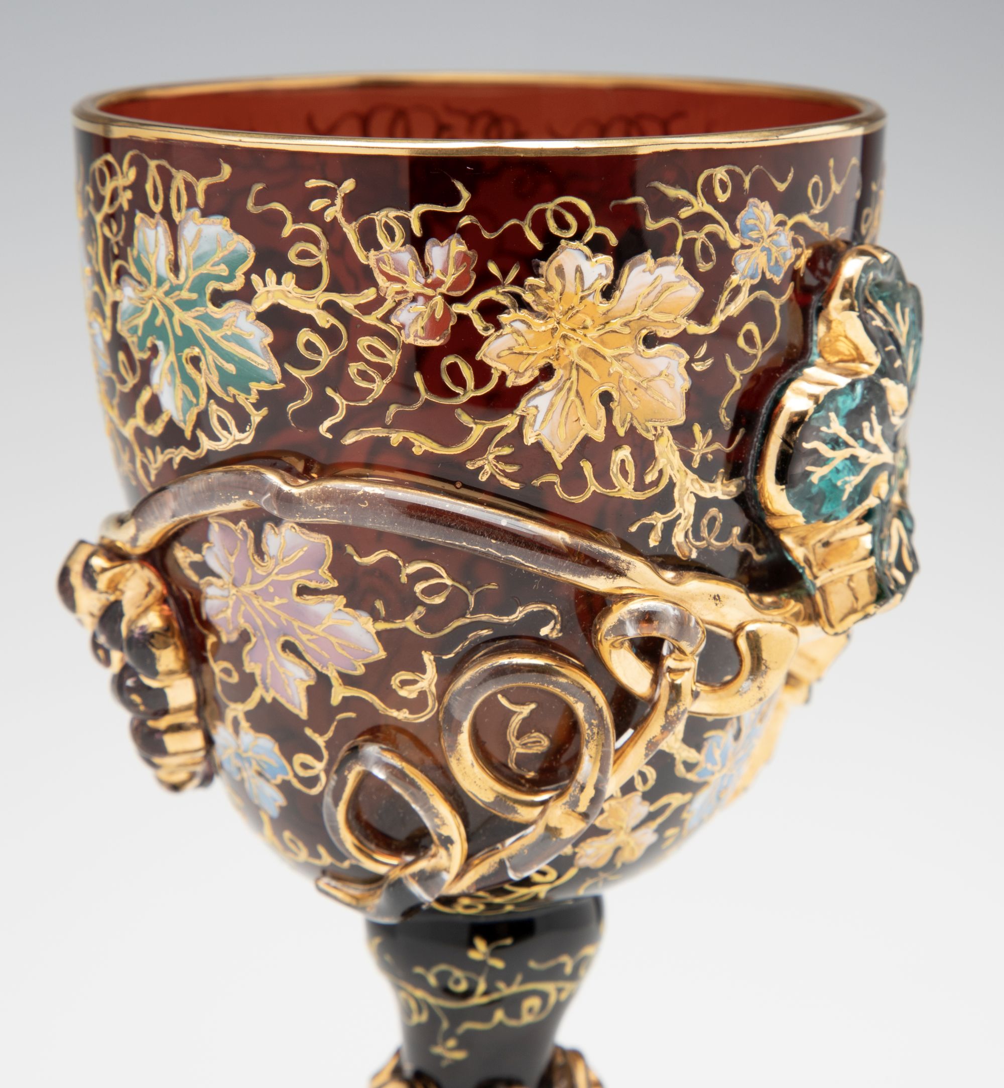 A MOSER DARK AMBERINA GOBLET WITH THICK APPLICATIONS