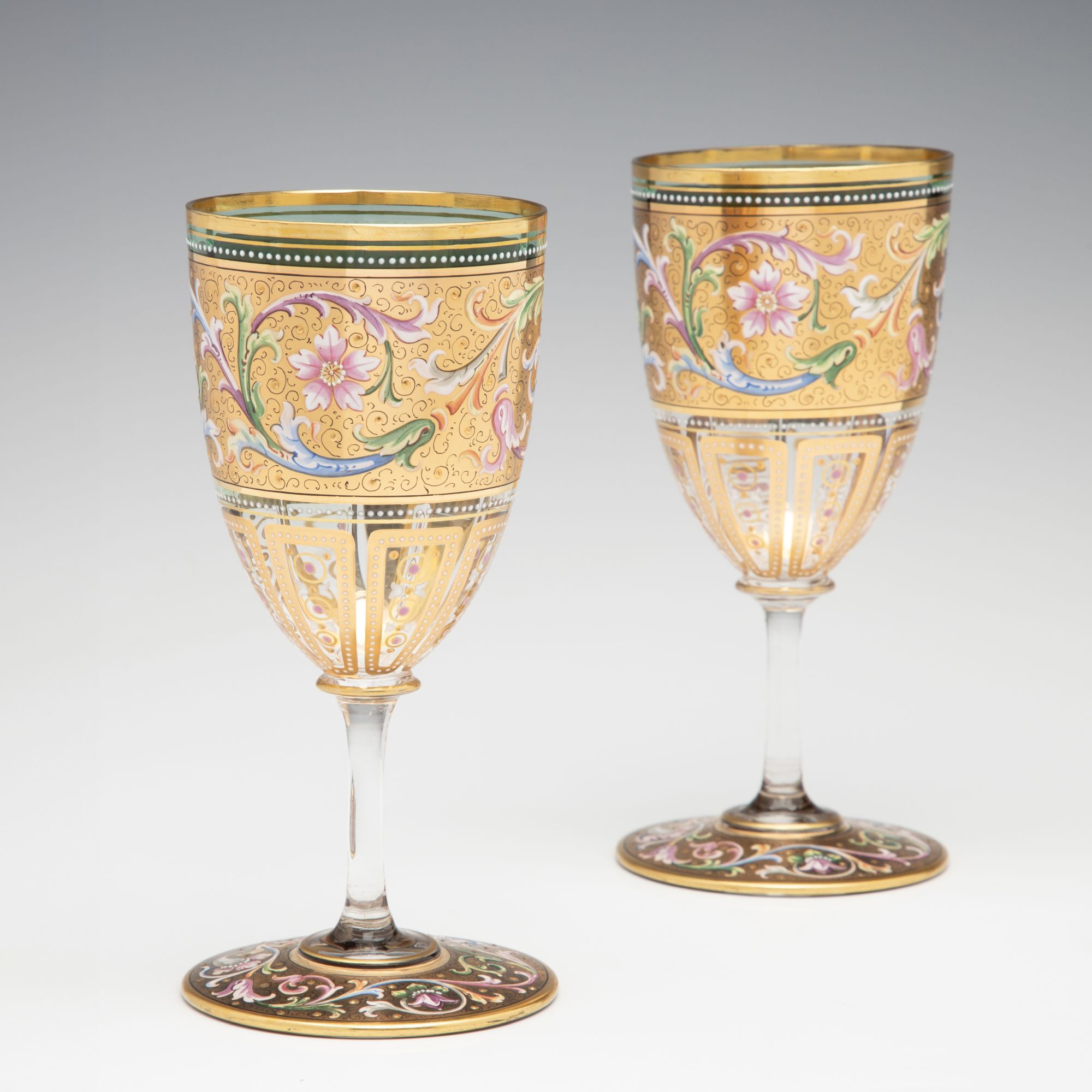 A FINE PAIR OF MOSER GILT AND ENAMEL DECORATED GOBLETS