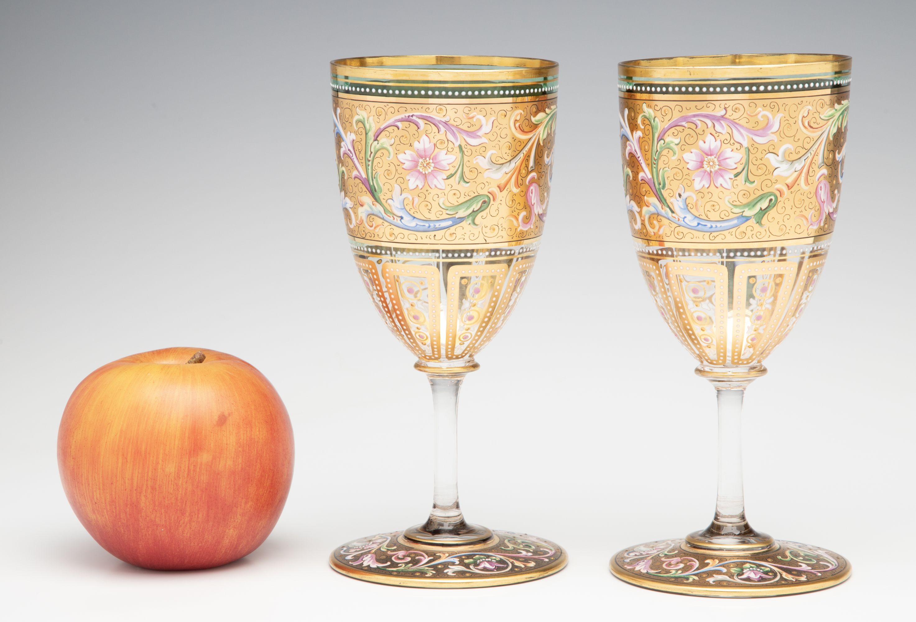 A FINE PAIR OF MOSER GILT AND ENAMEL DECORATED GOBLETS