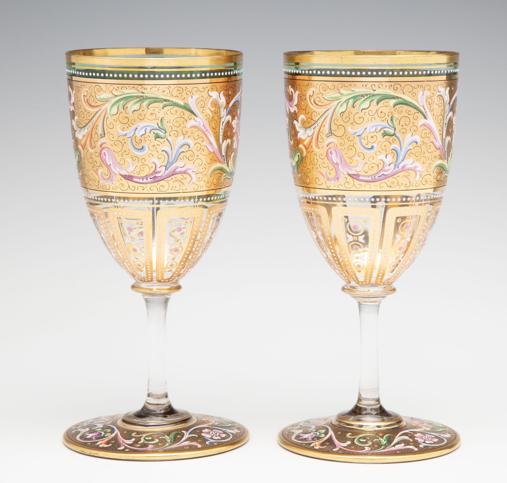 A FINE PAIR OF MOSER GILT AND ENAMEL DECORATED GOBLETS