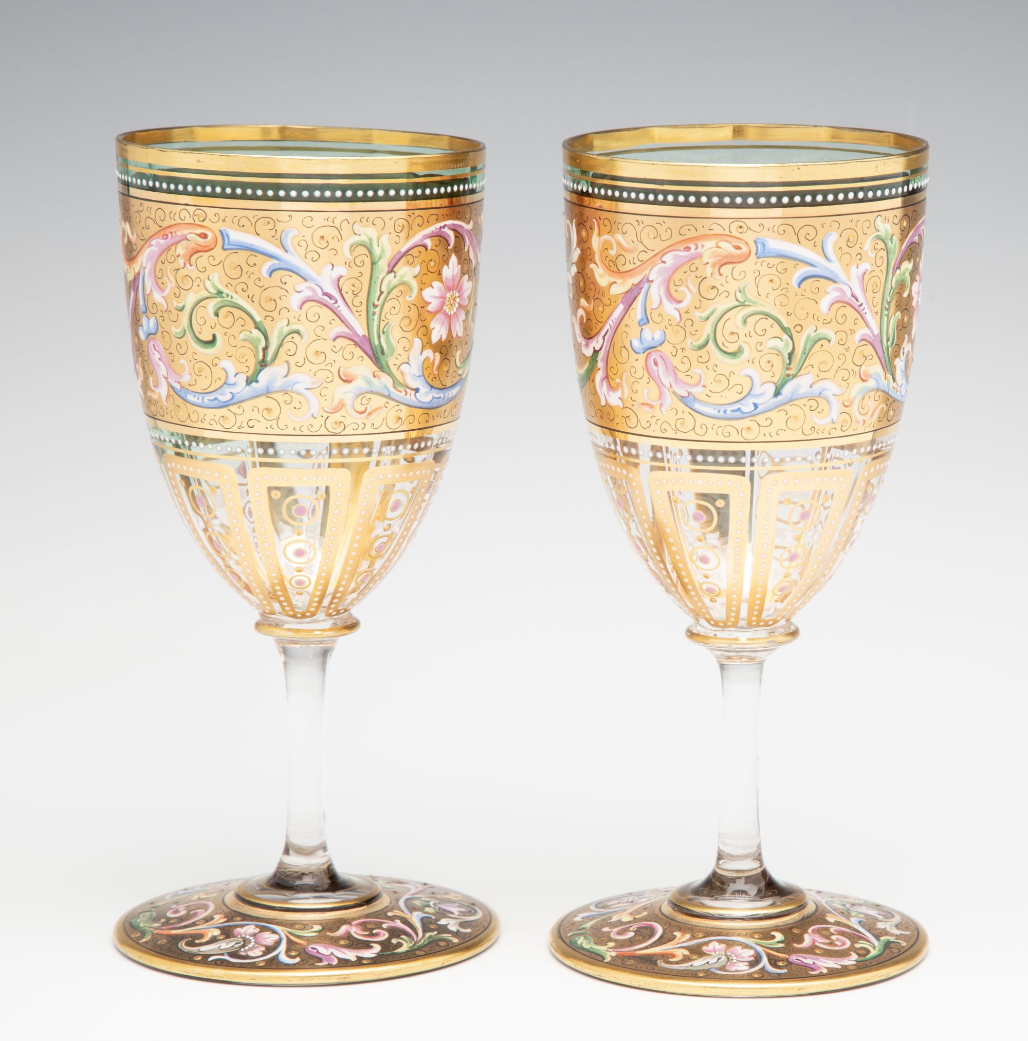 A FINE PAIR OF MOSER GILT AND ENAMEL DECORATED GOBLETS