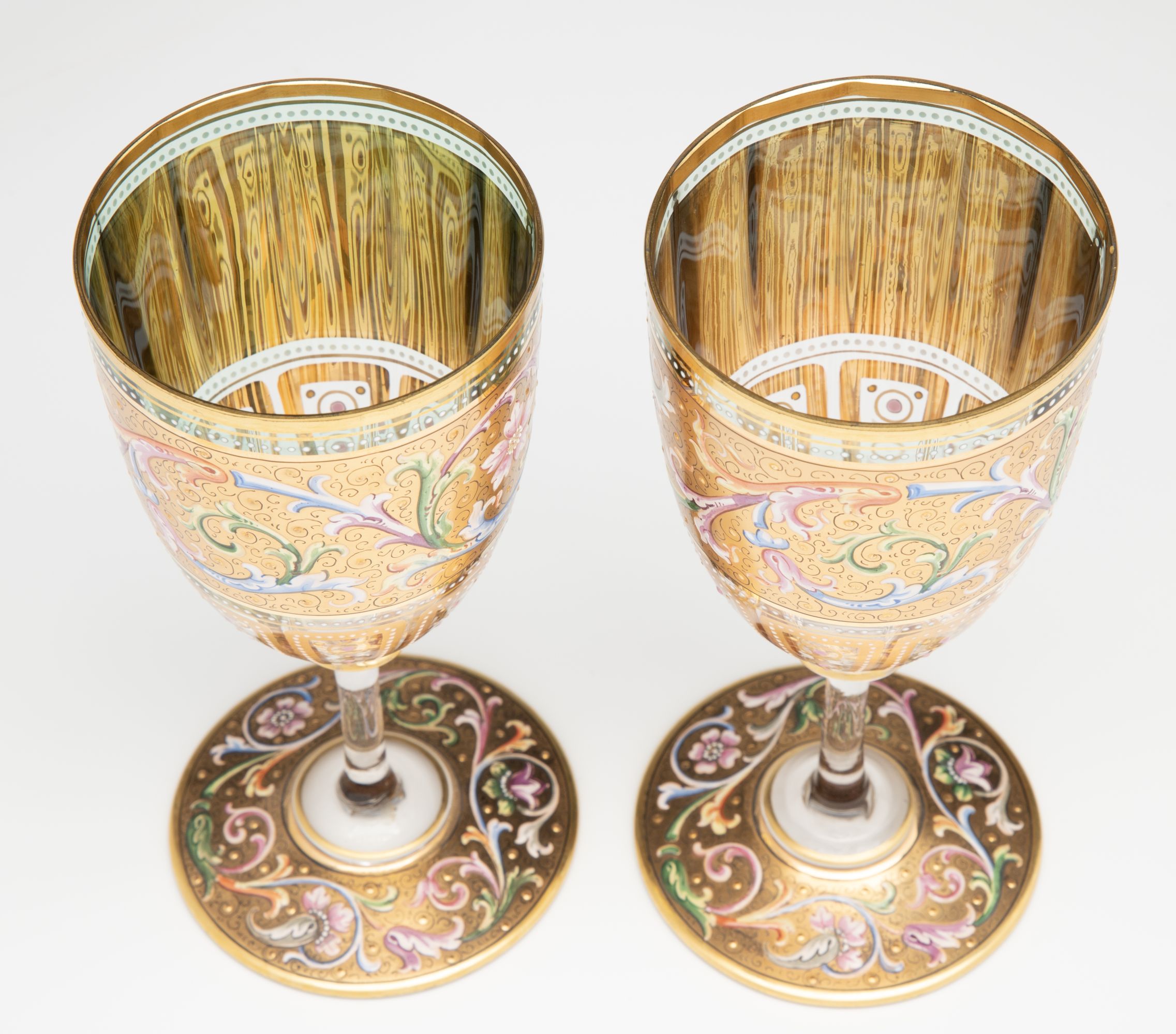 A FINE PAIR OF MOSER GILT AND ENAMEL DECORATED GOBLETS