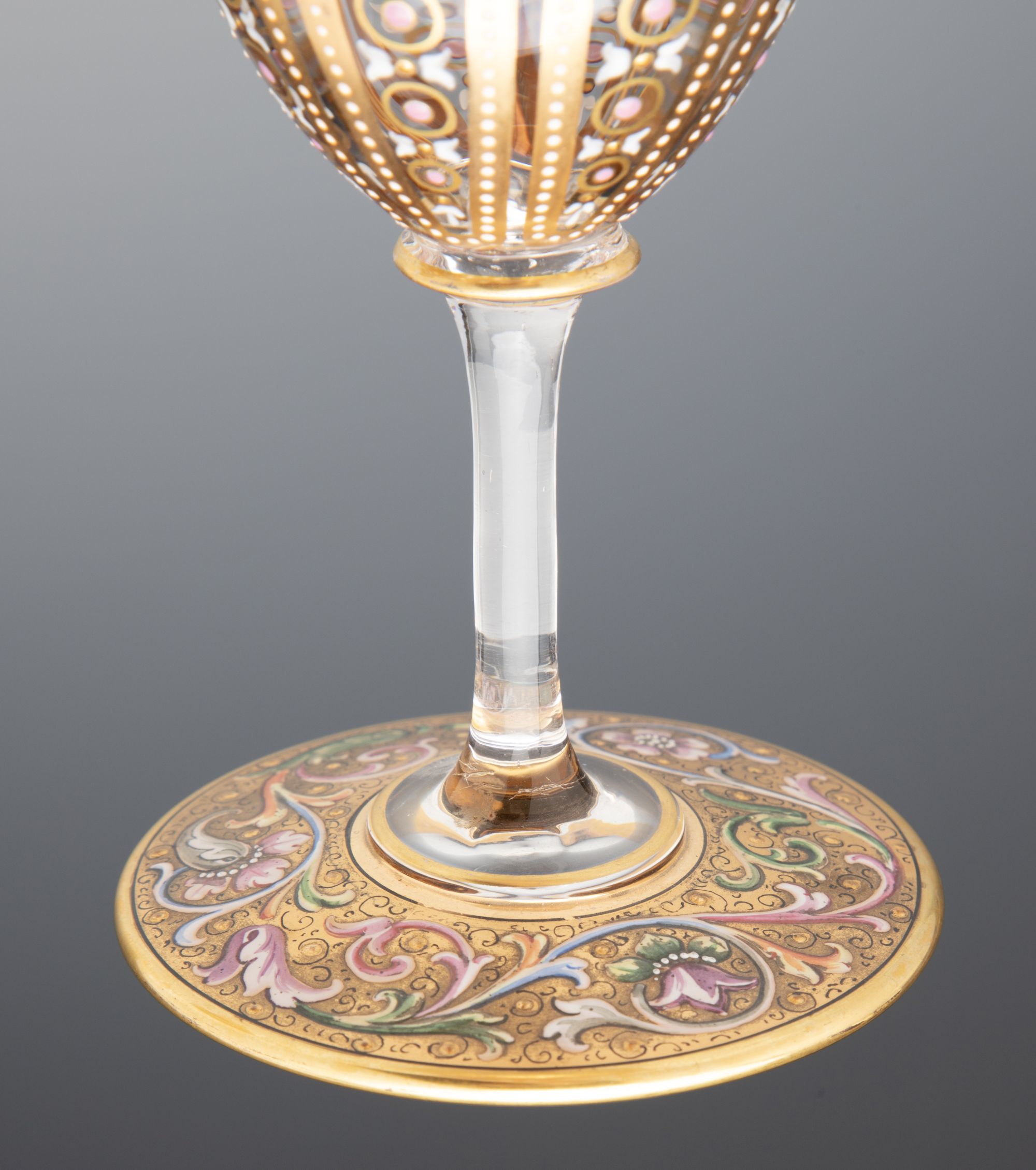 A FINE PAIR OF MOSER GILT AND ENAMEL DECORATED GOBLETS