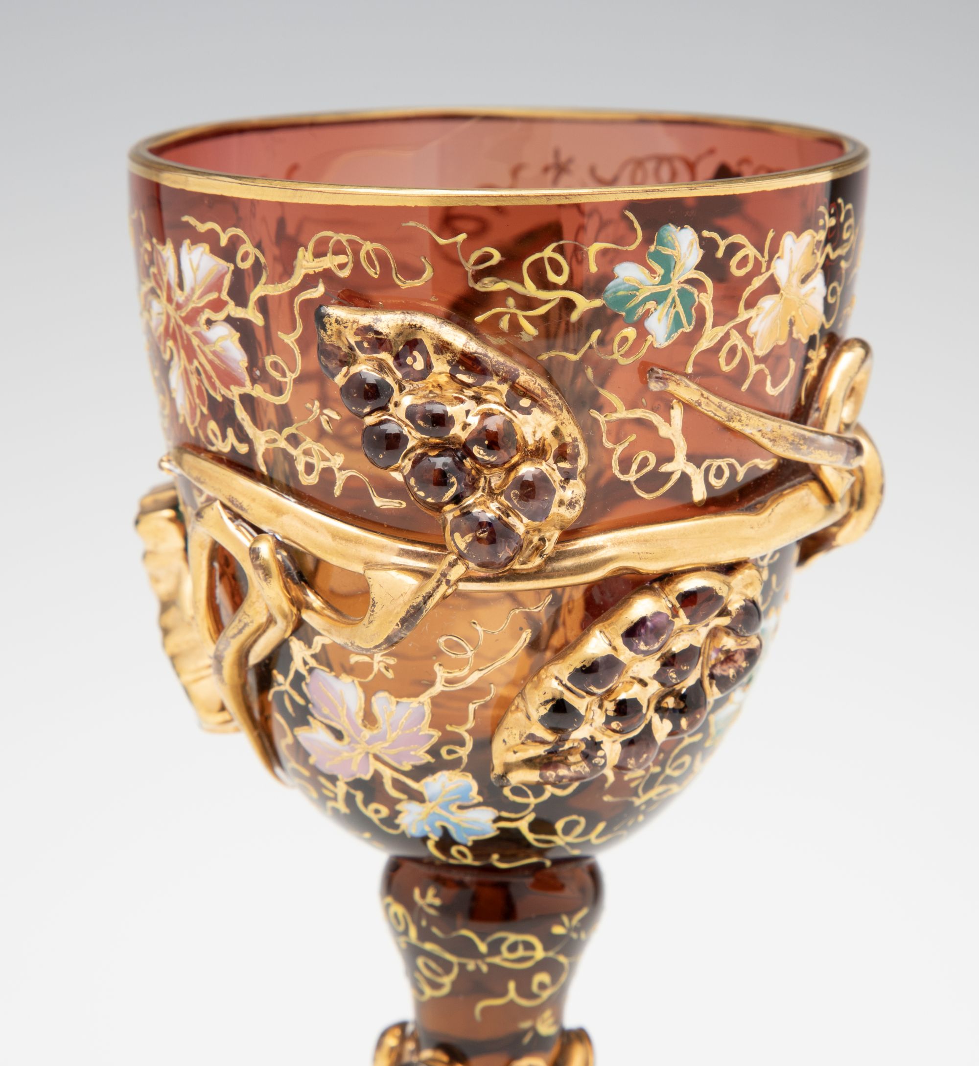 A MOSER DARK AMBERINA GOBLET WITH THICK APPLICATIONS