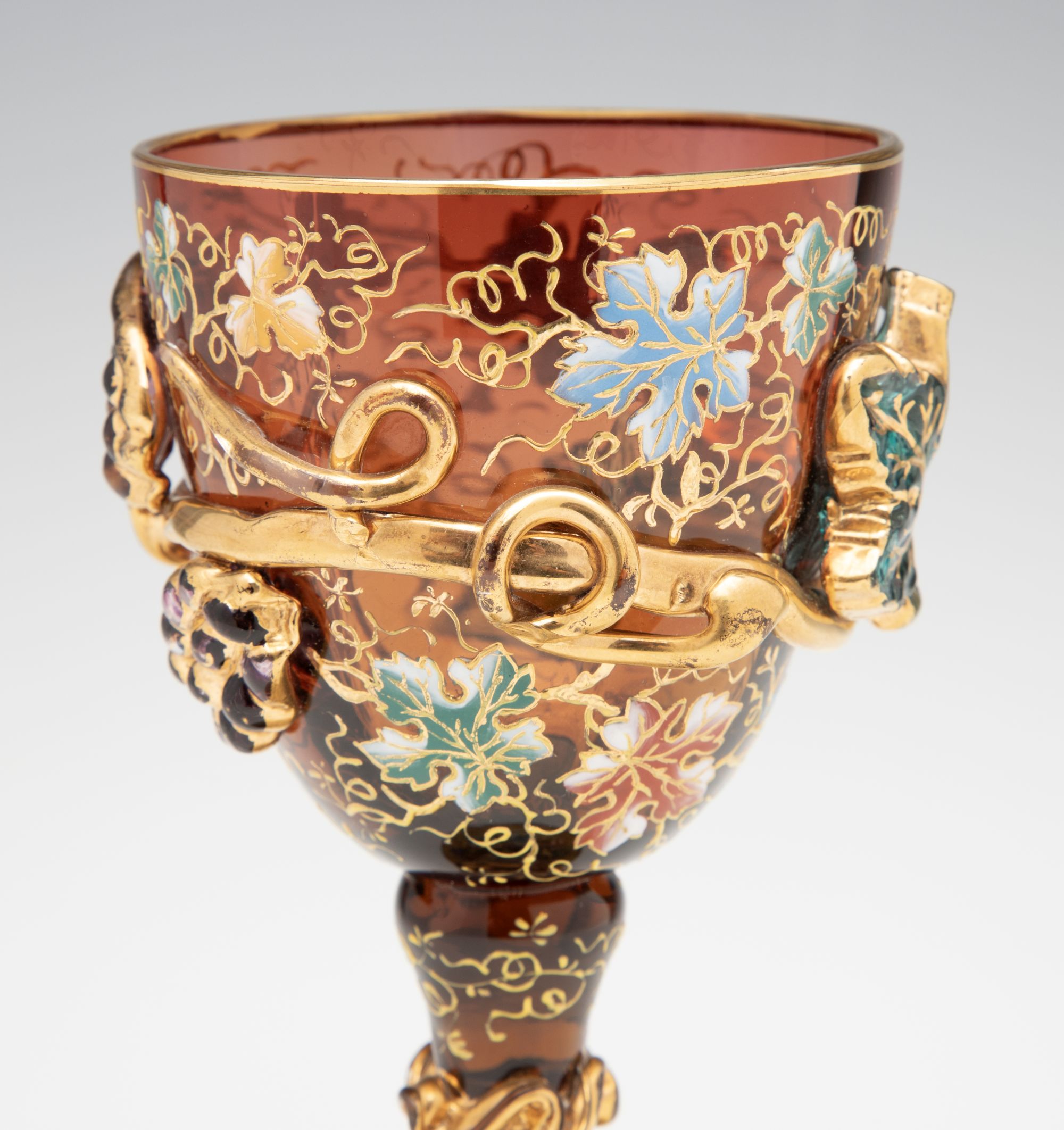 A MOSER DARK AMBERINA GOBLET WITH THICK APPLICATIONS