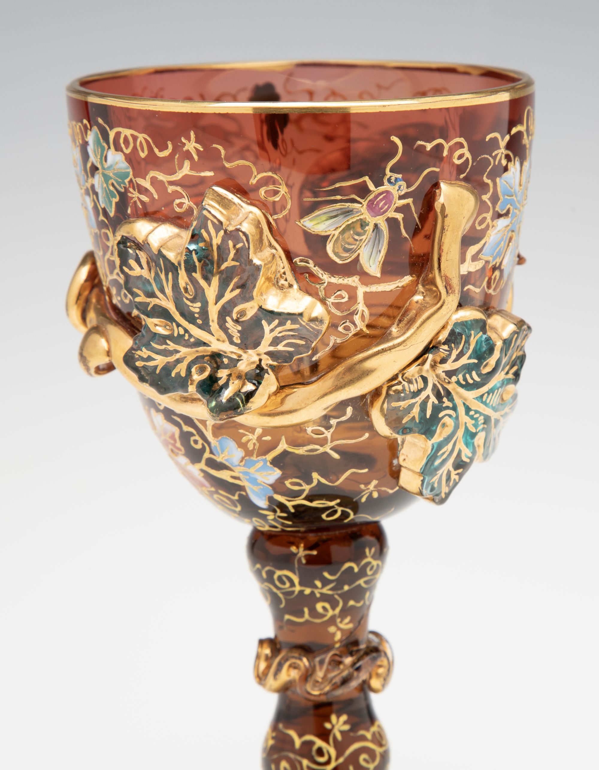 A MOSER DARK AMBERINA GOBLET WITH THICK APPLICATIONS