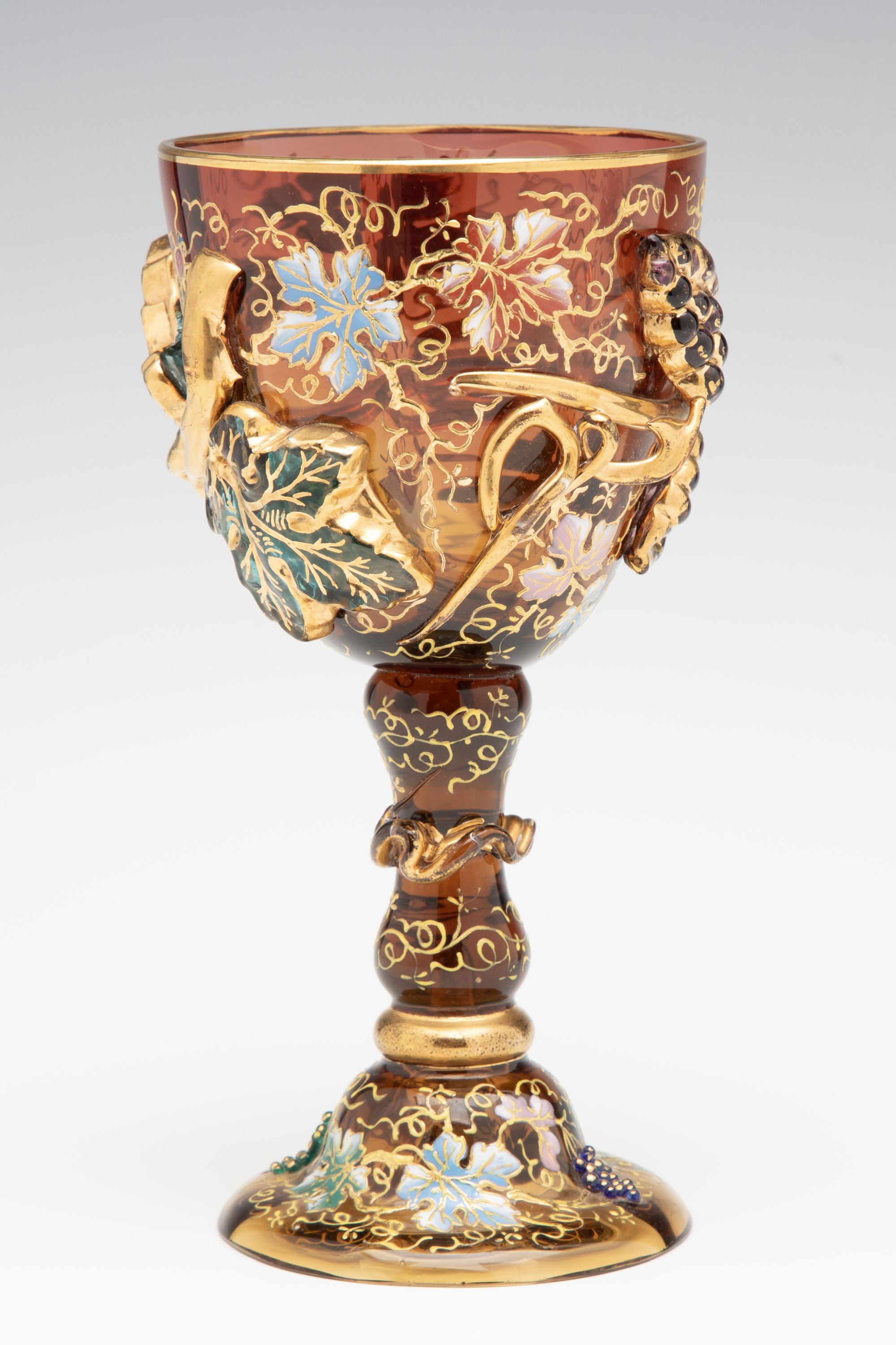 A MOSER DARK AMBERINA GOBLET WITH THICK APPLICATIONS