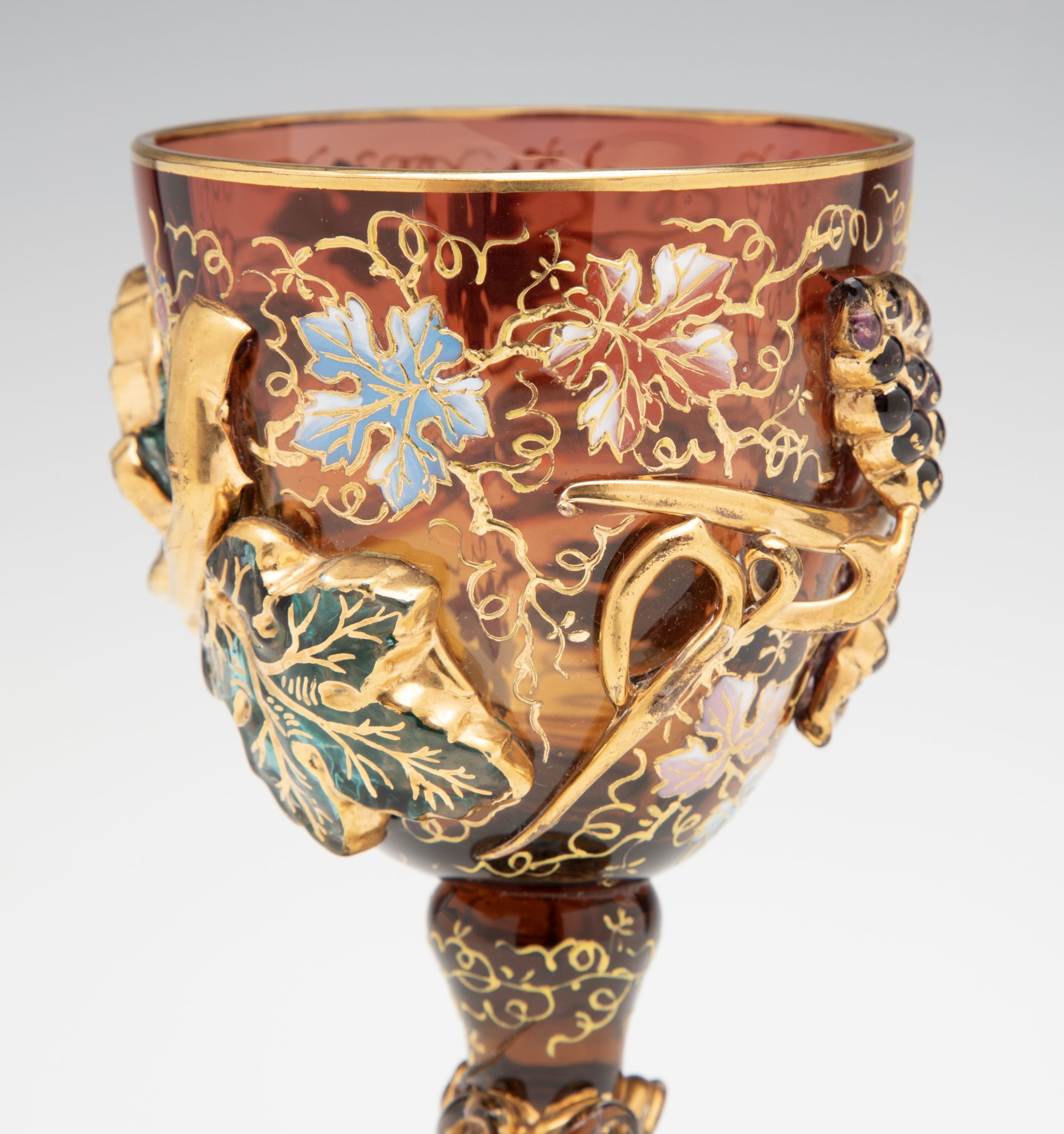 A MOSER DARK AMBERINA GOBLET WITH THICK APPLICATIONS