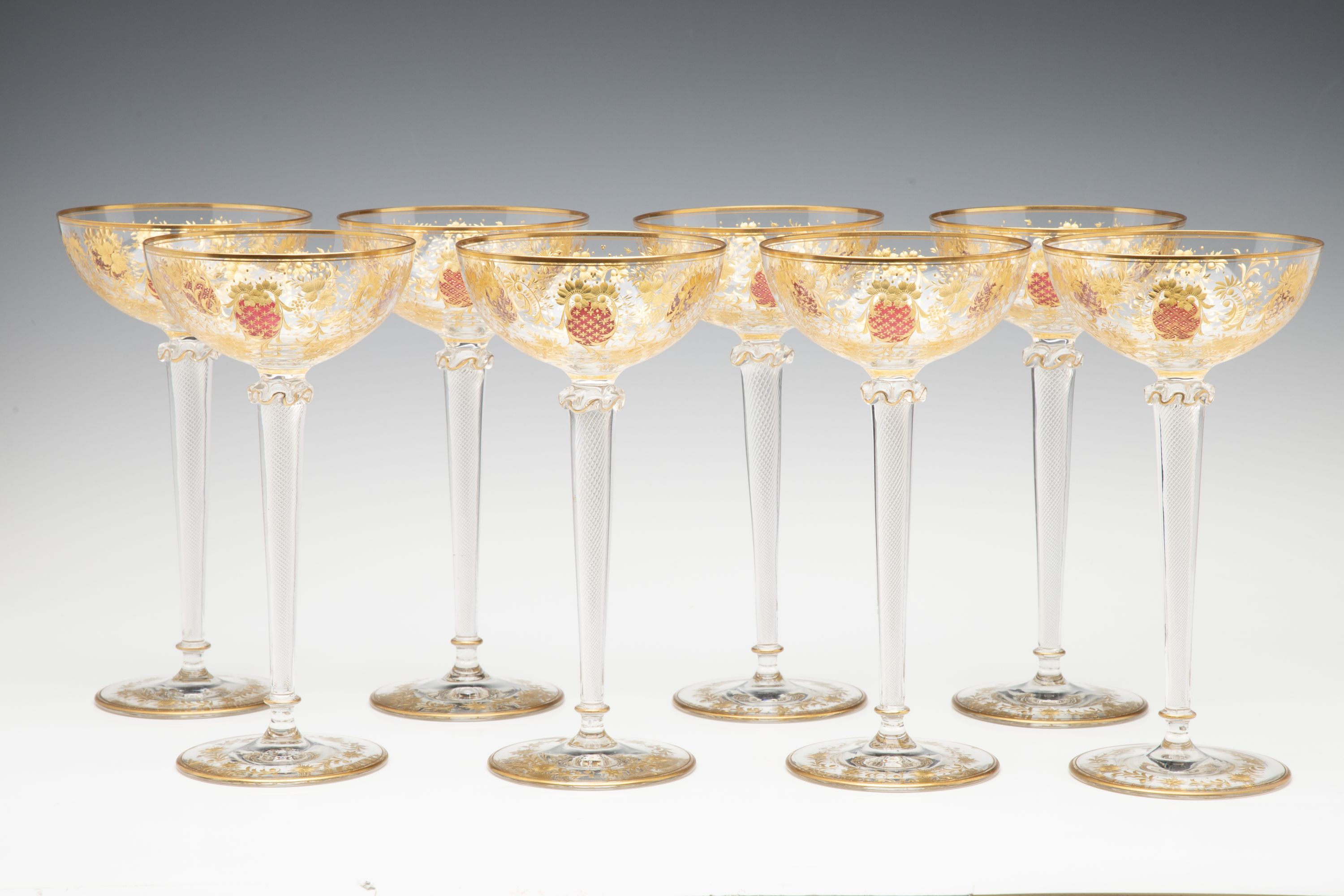 EIGHT TALL CONTINENTAL ART GLASS COUPE' STEMS C. 1920