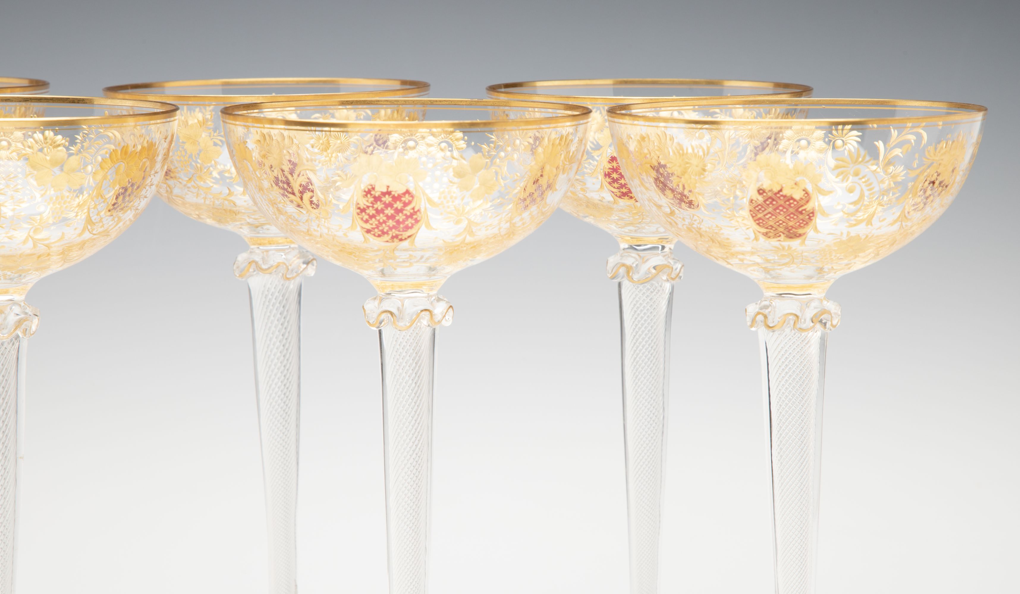 EIGHT TALL CONTINENTAL ART GLASS COUPE' STEMS C. 1920