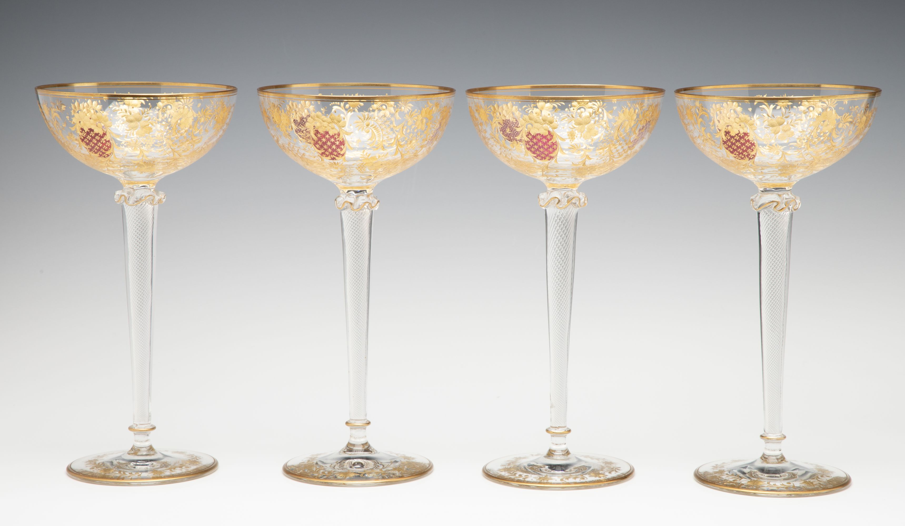 EIGHT TALL CONTINENTAL ART GLASS COUPE' STEMS C. 1920