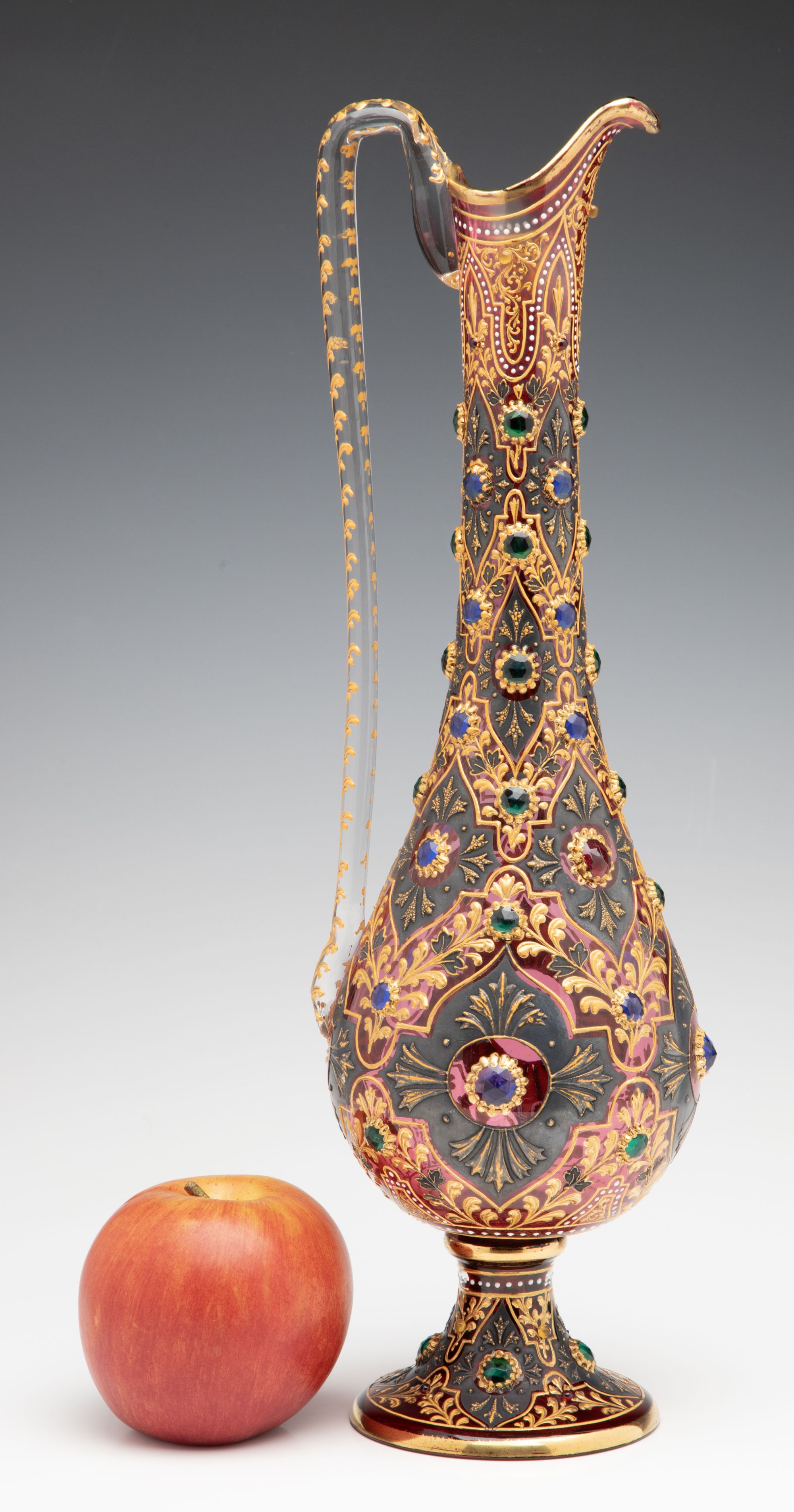 A JEWELED MOSER CRANBERRY EWER WITH MUGHAL DESIGNS