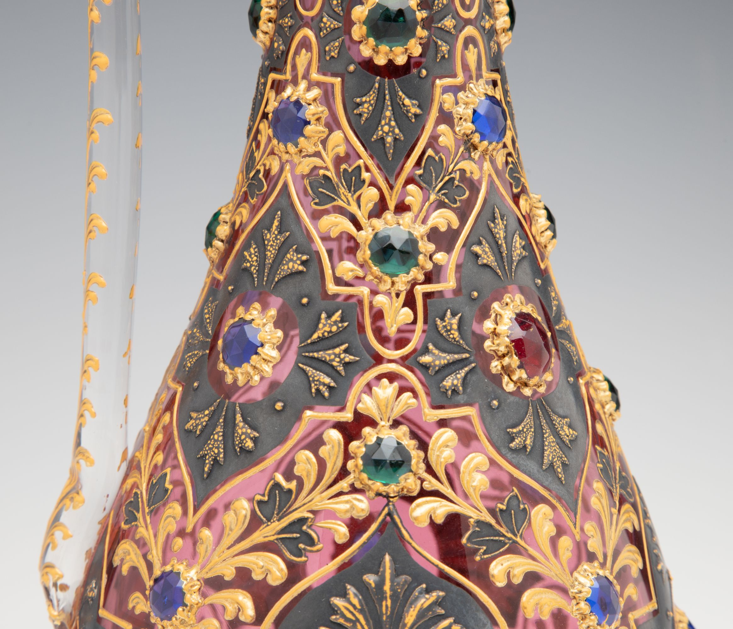 A JEWELED MOSER CRANBERRY EWER WITH MUGHAL DESIGNS