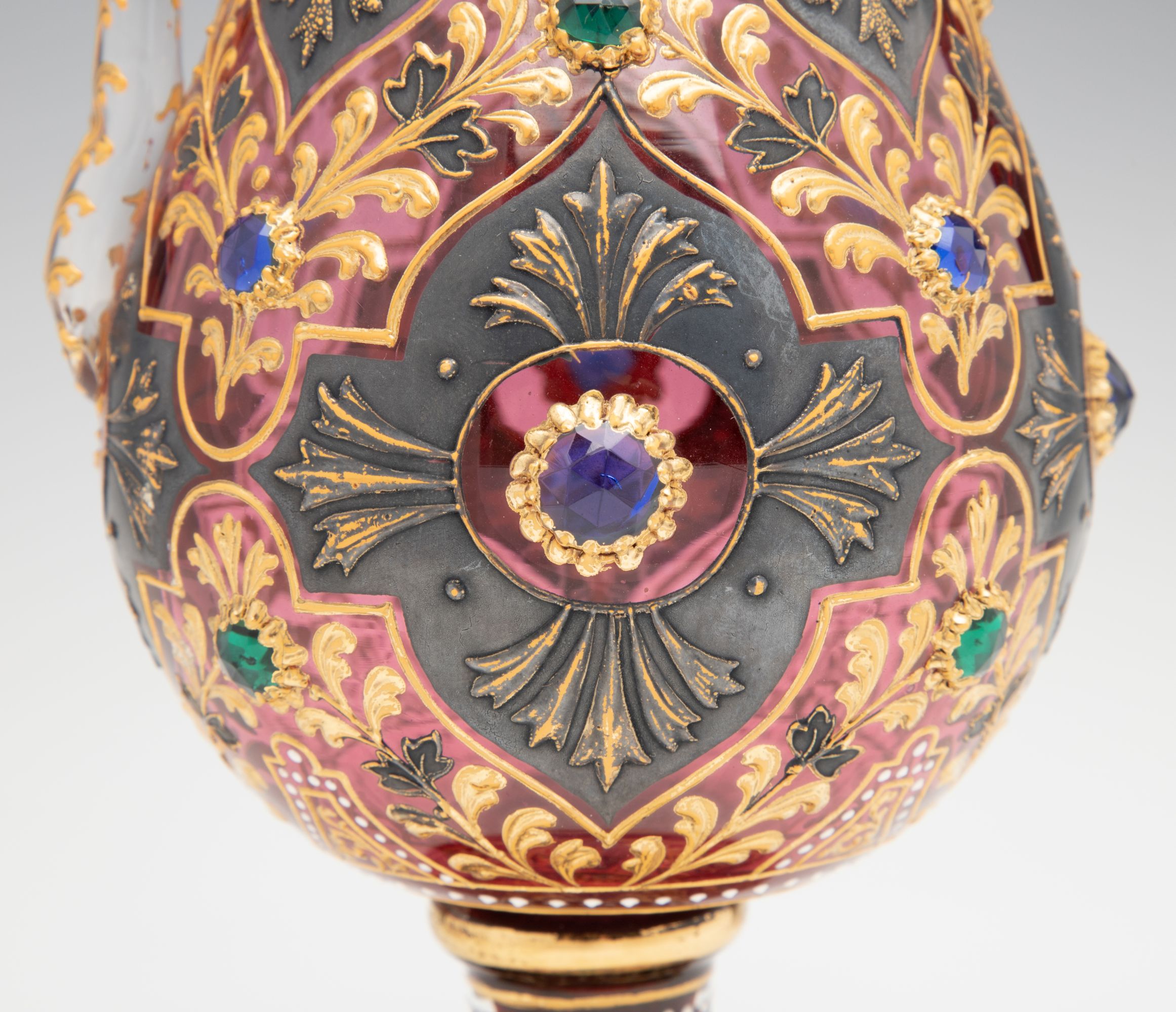 A JEWELED MOSER CRANBERRY EWER WITH MUGHAL DESIGNS