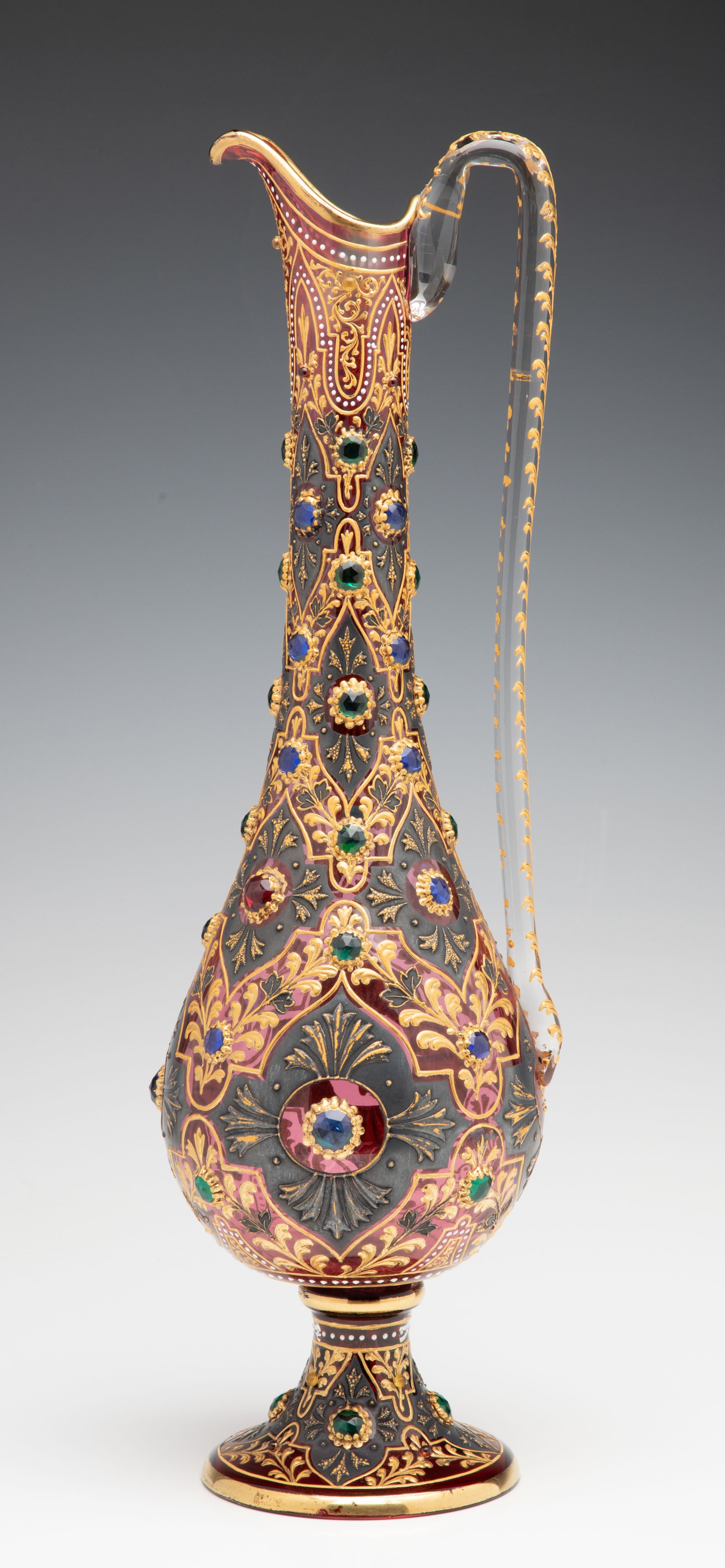 A JEWELED MOSER CRANBERRY EWER WITH MUGHAL DESIGNS