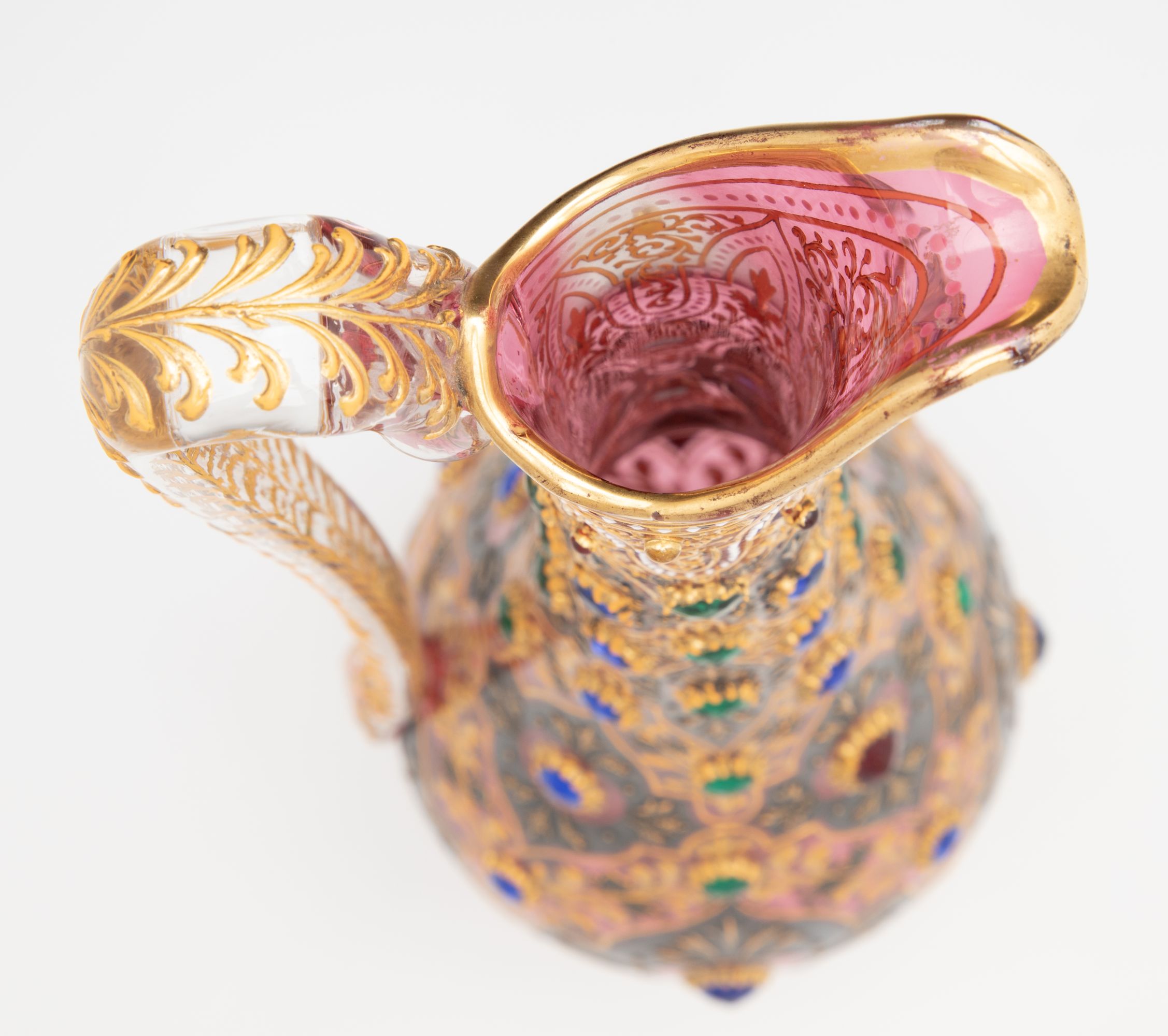 A JEWELED MOSER CRANBERRY EWER WITH MUGHAL DESIGNS