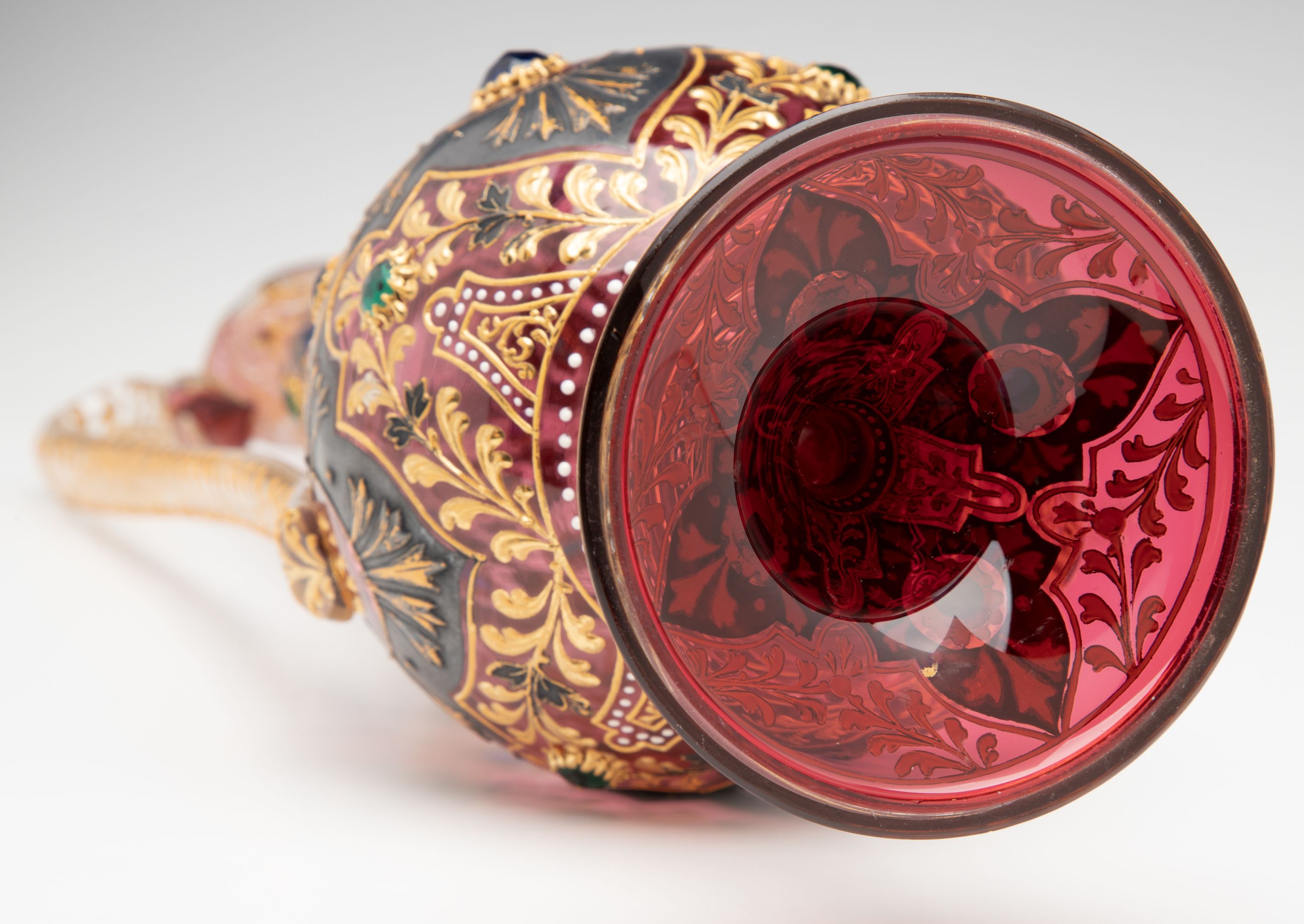 A JEWELED MOSER CRANBERRY EWER WITH MUGHAL DESIGNS