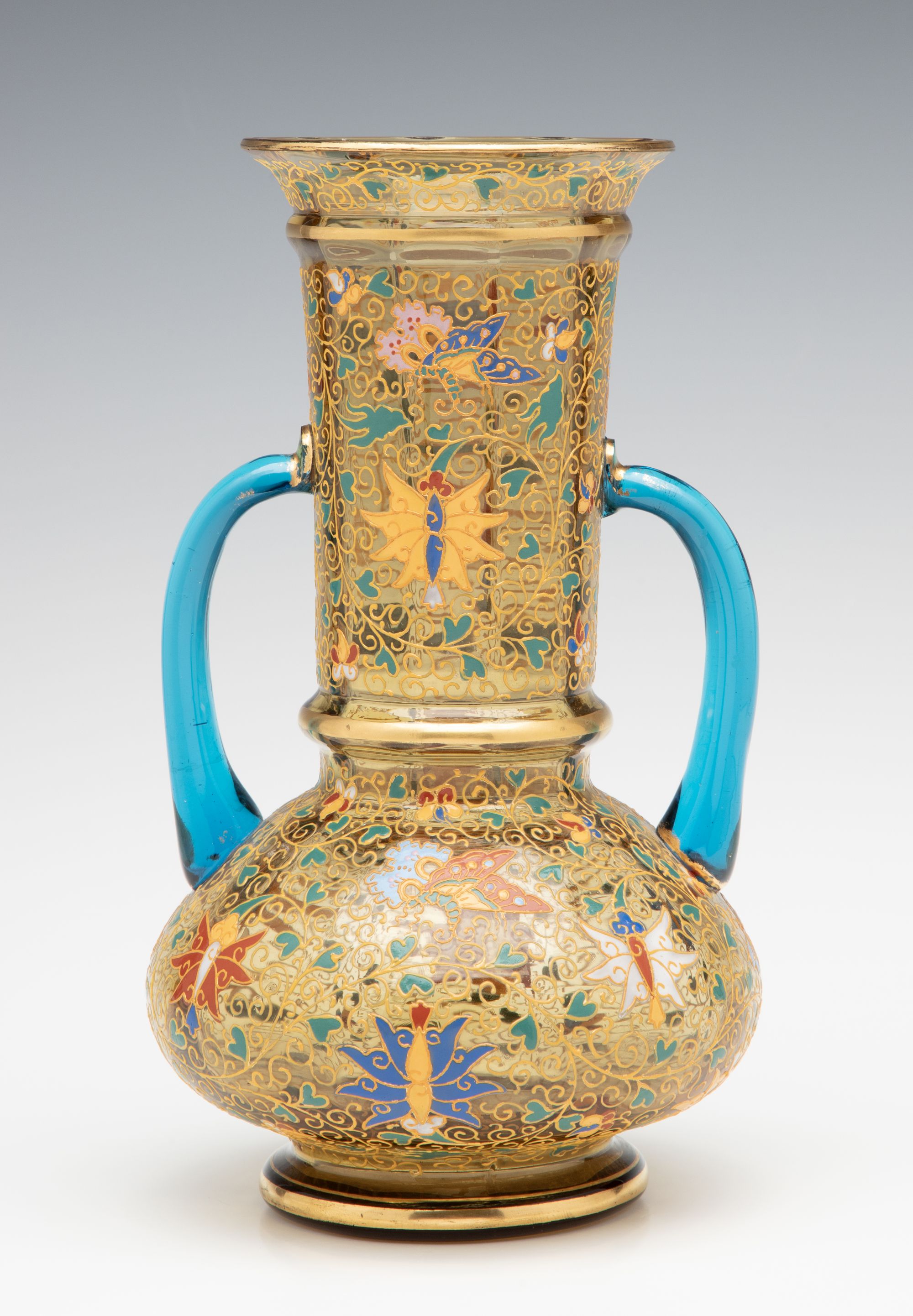 A MOSER GILT AND ENAMELED URN WITH APPLIED BLUE HANDLES