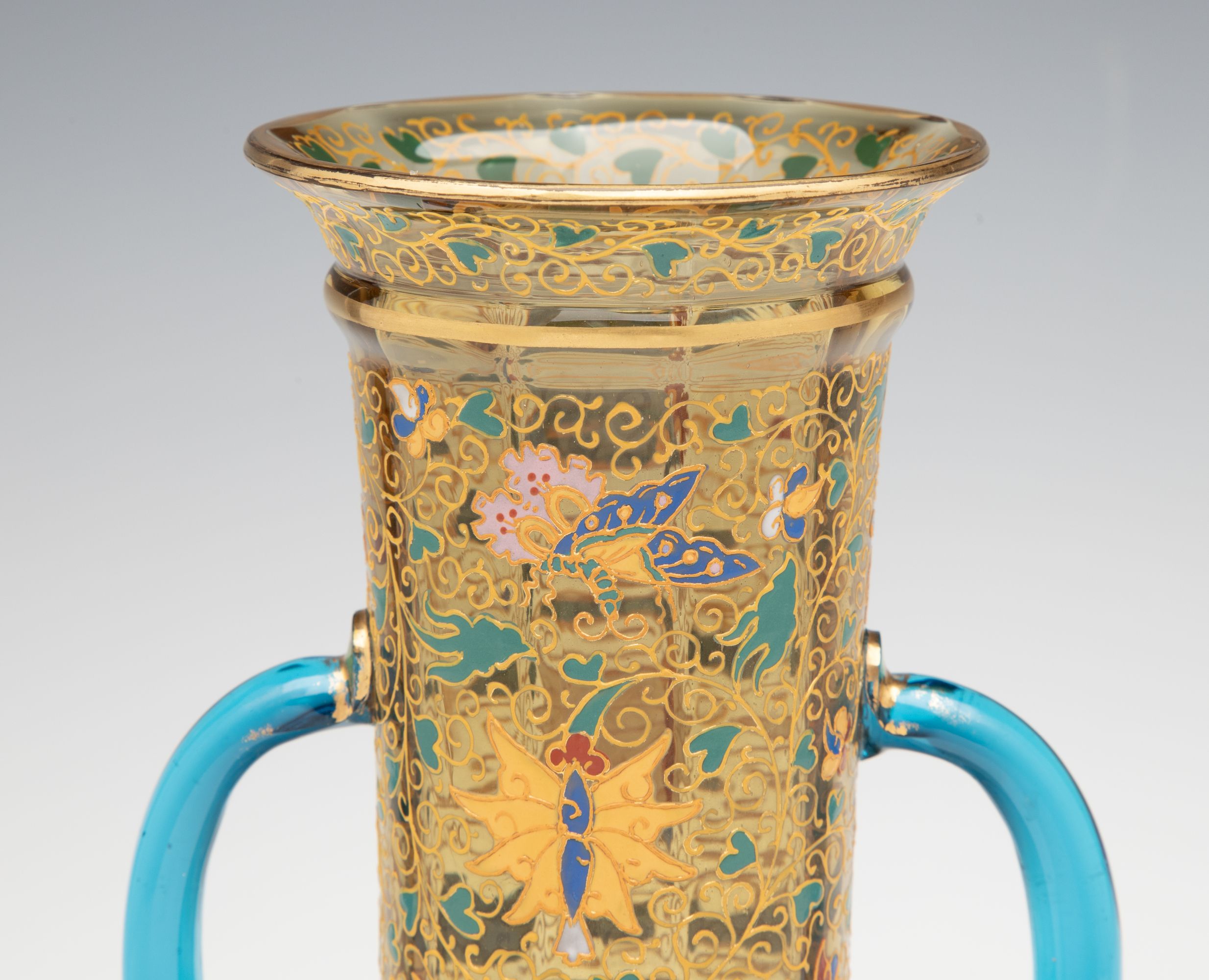 A MOSER GILT AND ENAMELED URN WITH APPLIED BLUE HANDLES