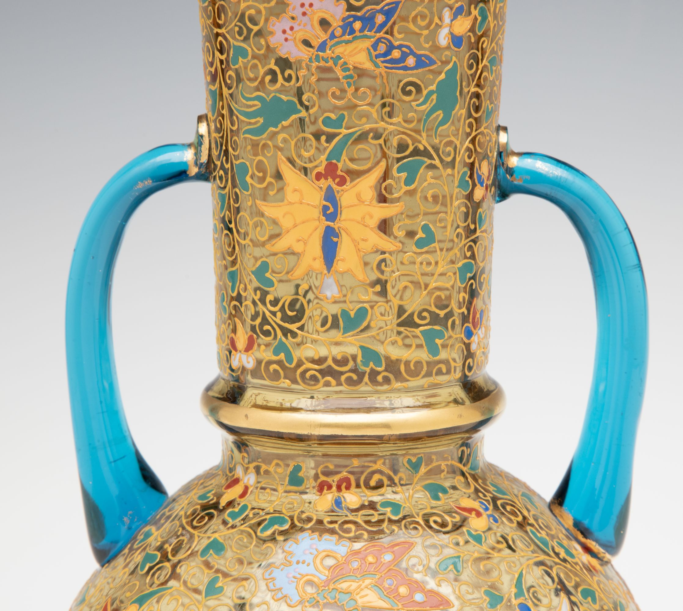 A MOSER GILT AND ENAMELED URN WITH APPLIED BLUE HANDLES