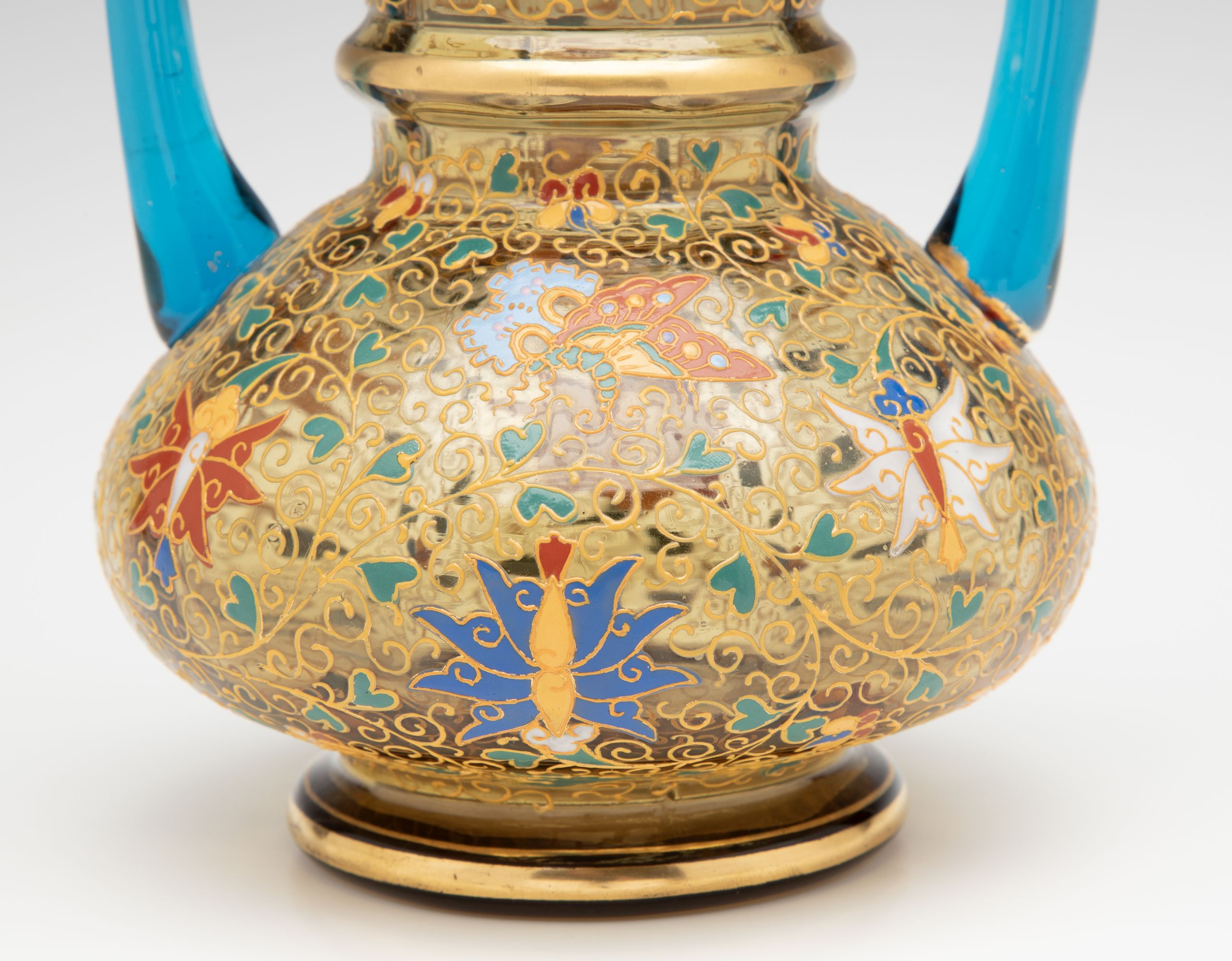 A MOSER GILT AND ENAMELED URN WITH APPLIED BLUE HANDLES