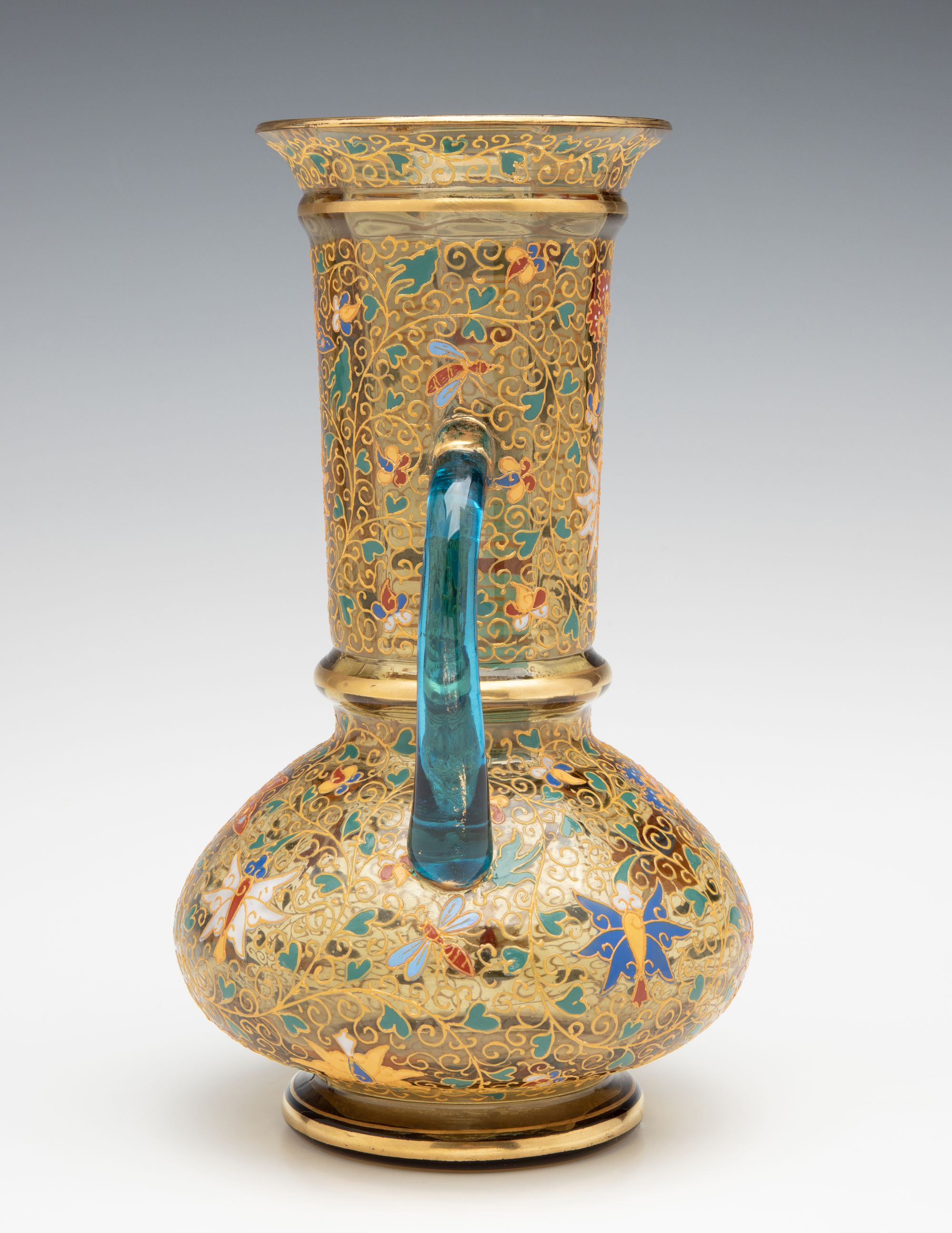 A MOSER GILT AND ENAMELED URN WITH APPLIED BLUE HANDLES