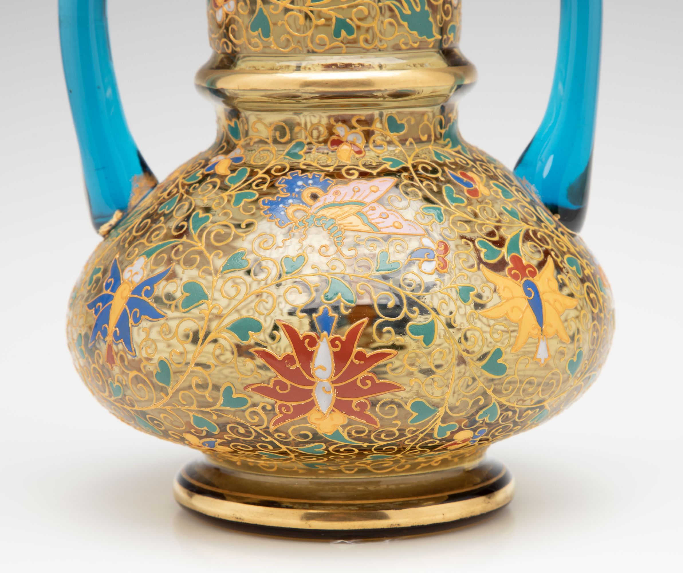 A MOSER GILT AND ENAMELED URN WITH APPLIED BLUE HANDLES