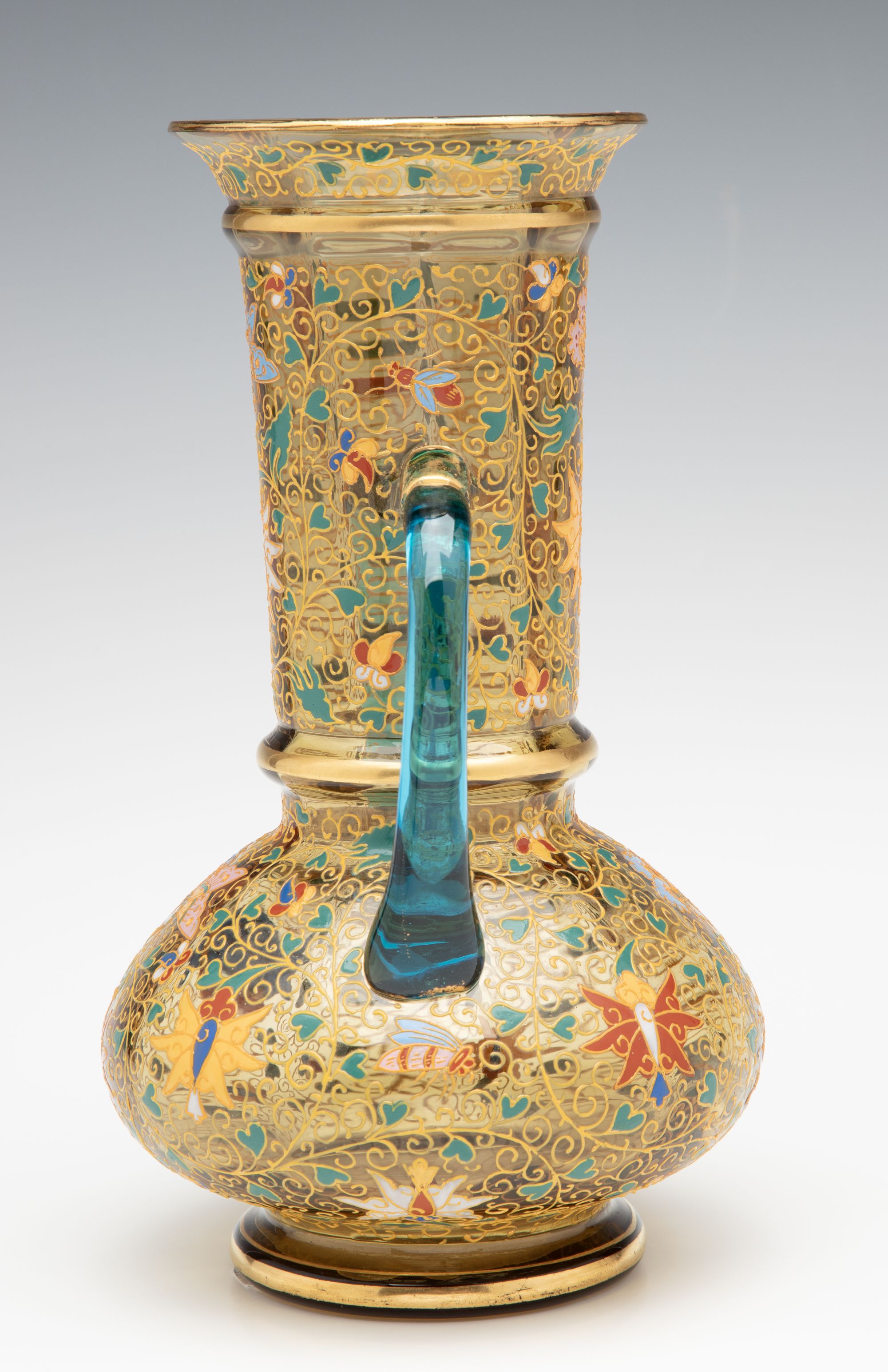 A MOSER GILT AND ENAMELED URN WITH APPLIED BLUE HANDLES