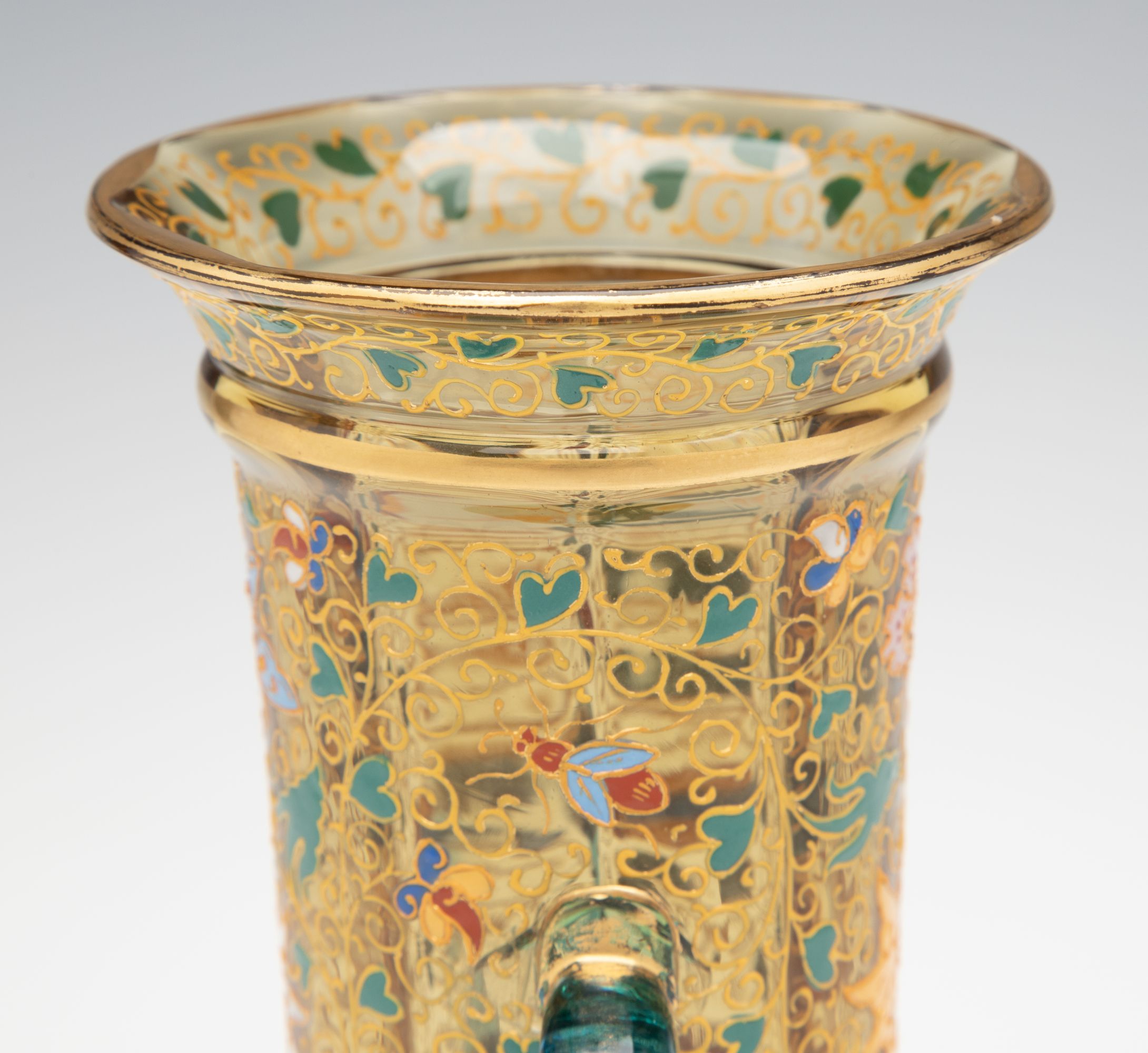 A MOSER GILT AND ENAMELED URN WITH APPLIED BLUE HANDLES