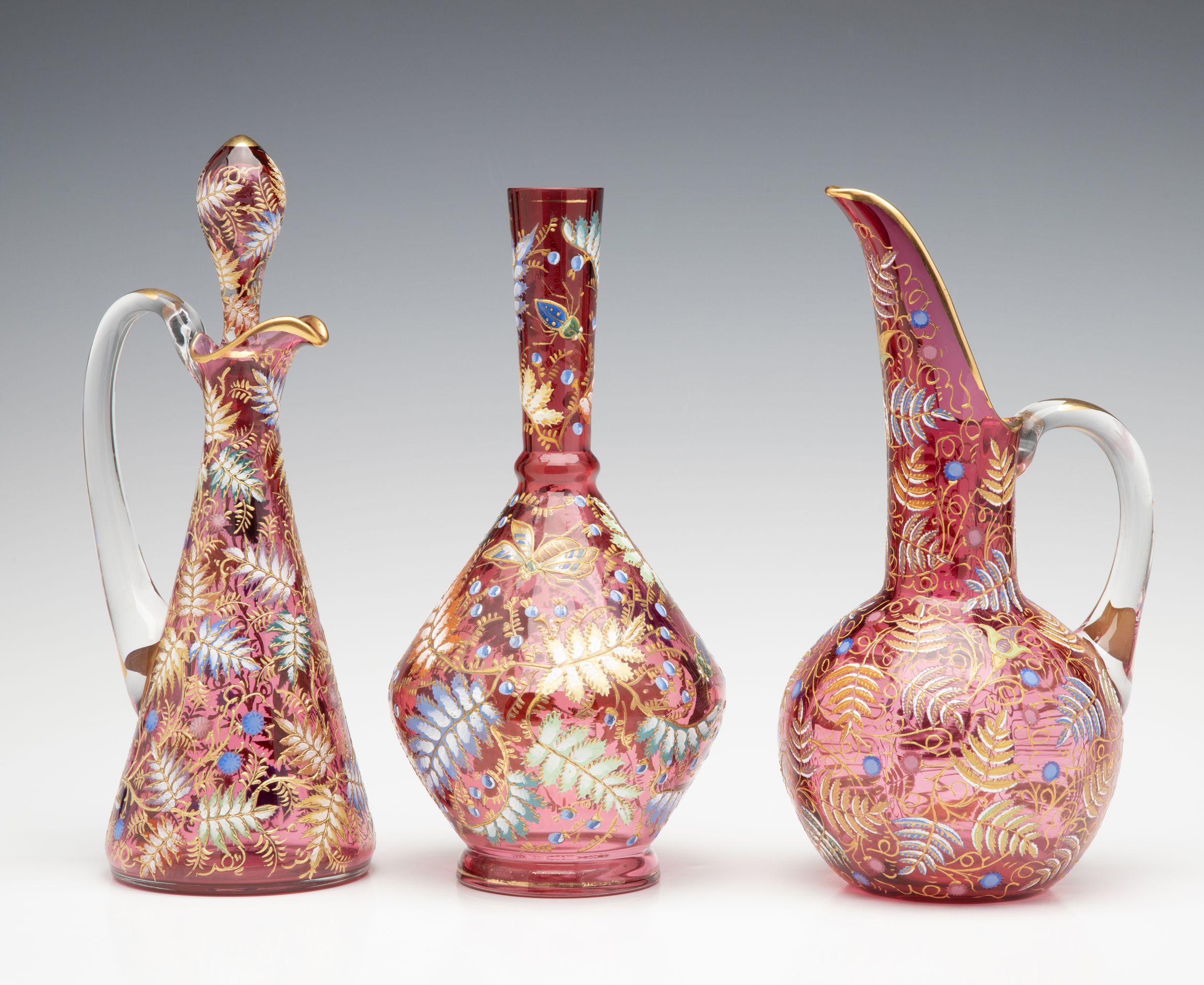 A GROUPING OF GILT AND ENAMEL DECORATED MOSER ART GLASS