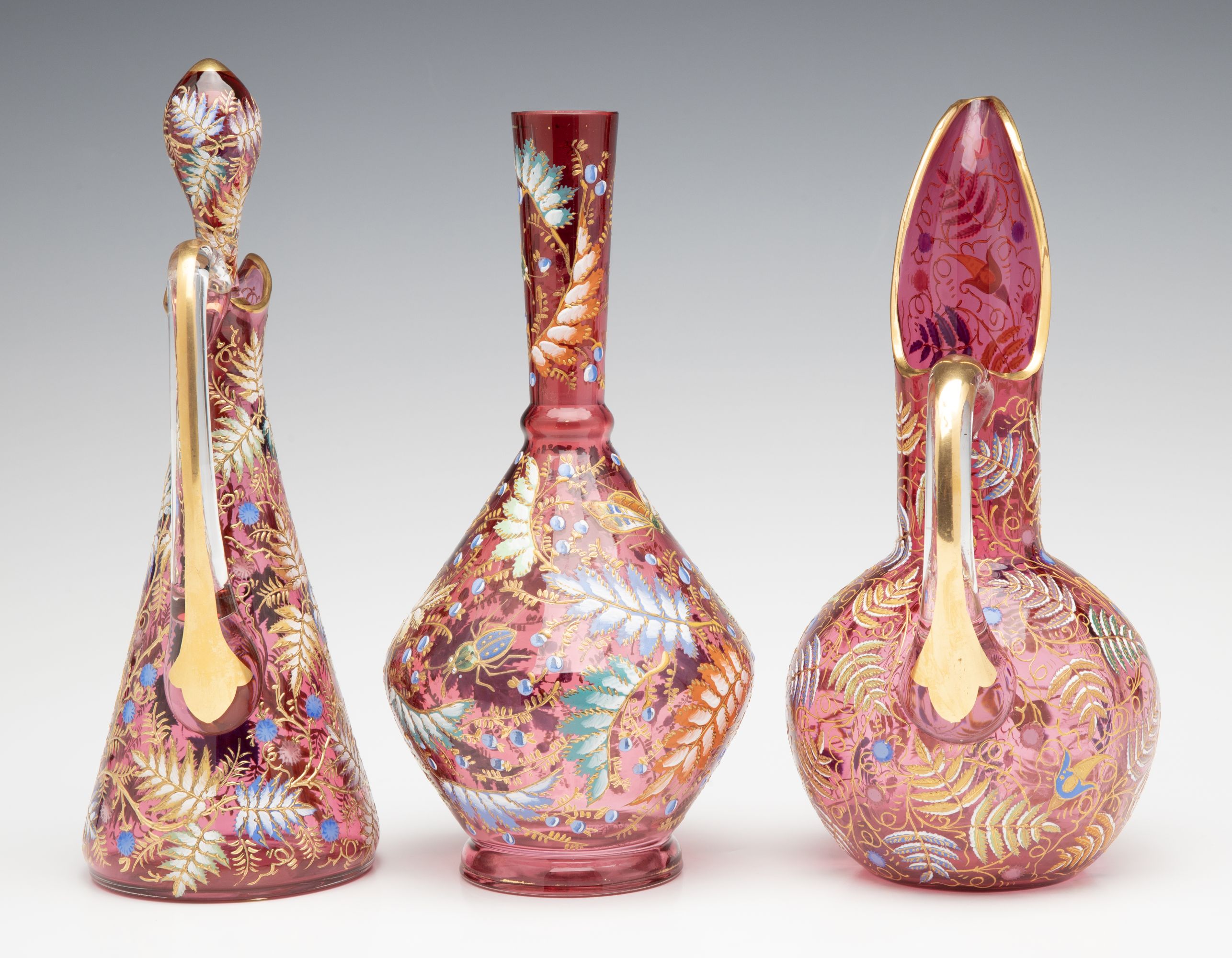 A GROUPING OF GILT AND ENAMEL DECORATED MOSER ART GLASS