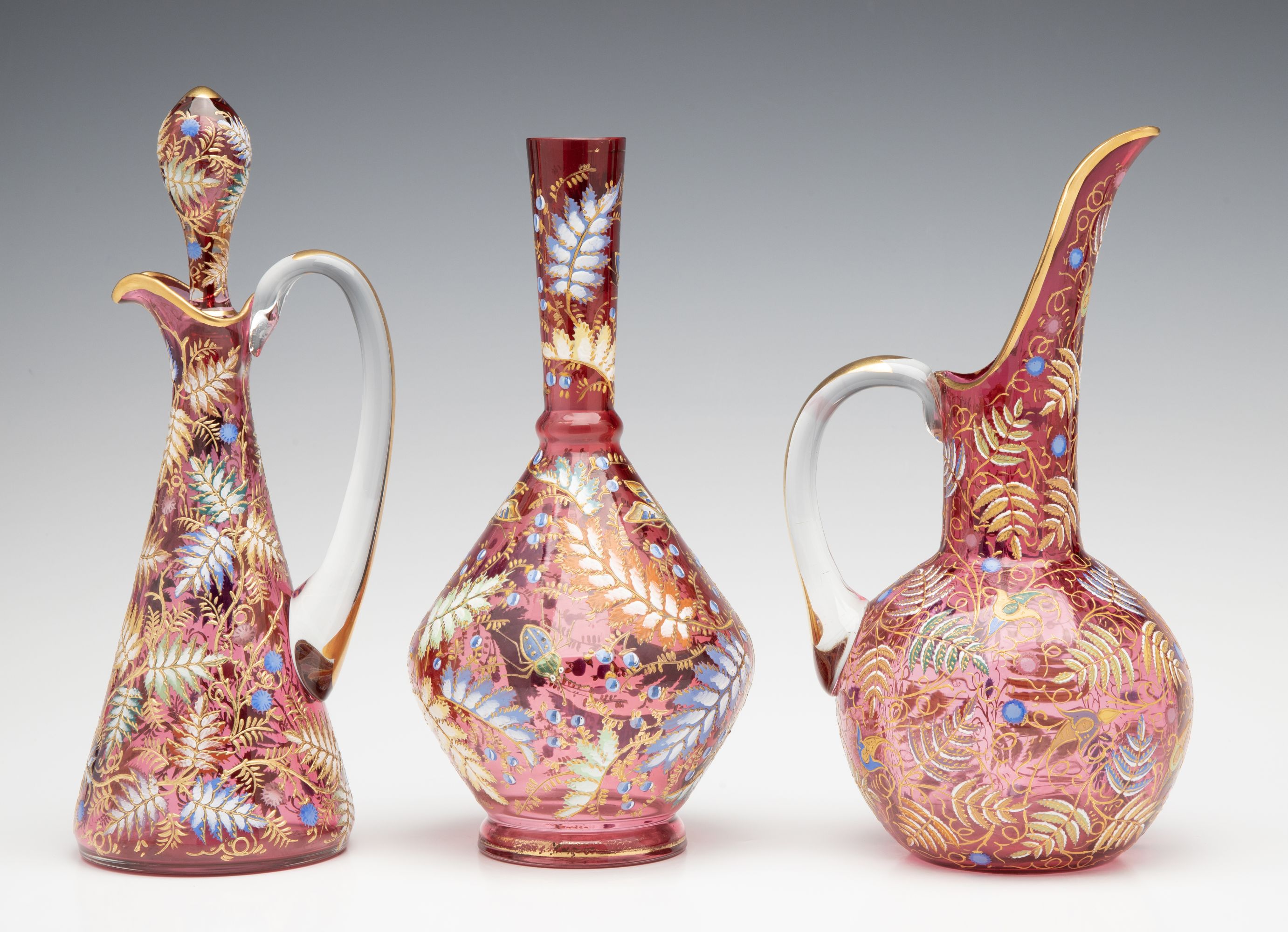 A GROUPING OF GILT AND ENAMEL DECORATED MOSER ART GLASS