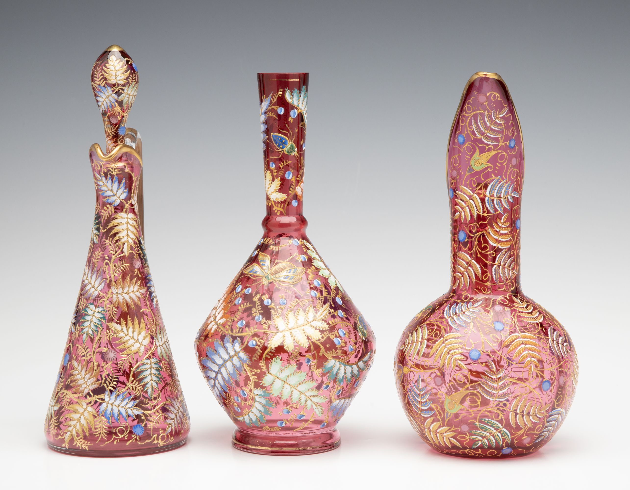 A GROUPING OF GILT AND ENAMEL DECORATED MOSER ART GLASS