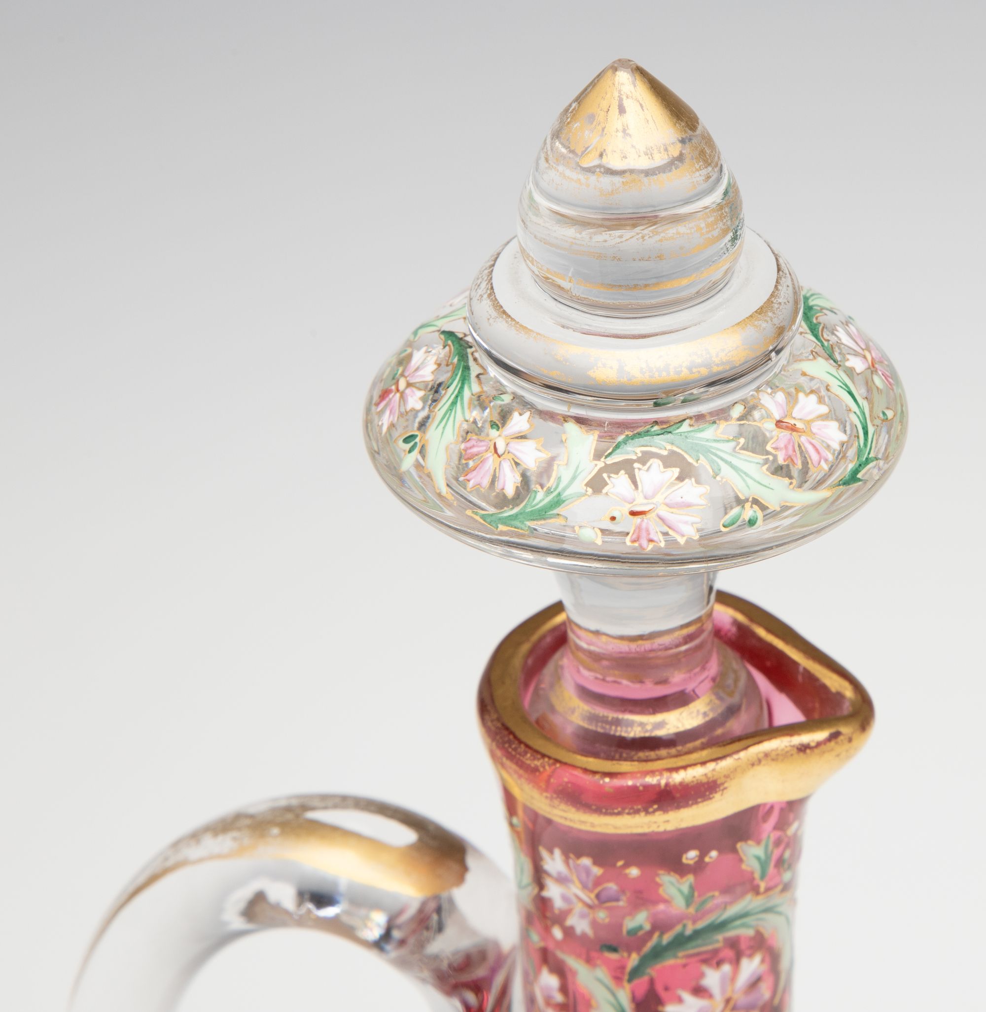 A LAVISHLY DECORATED CRANBERRY GLASS CRUET ATTR MOSER