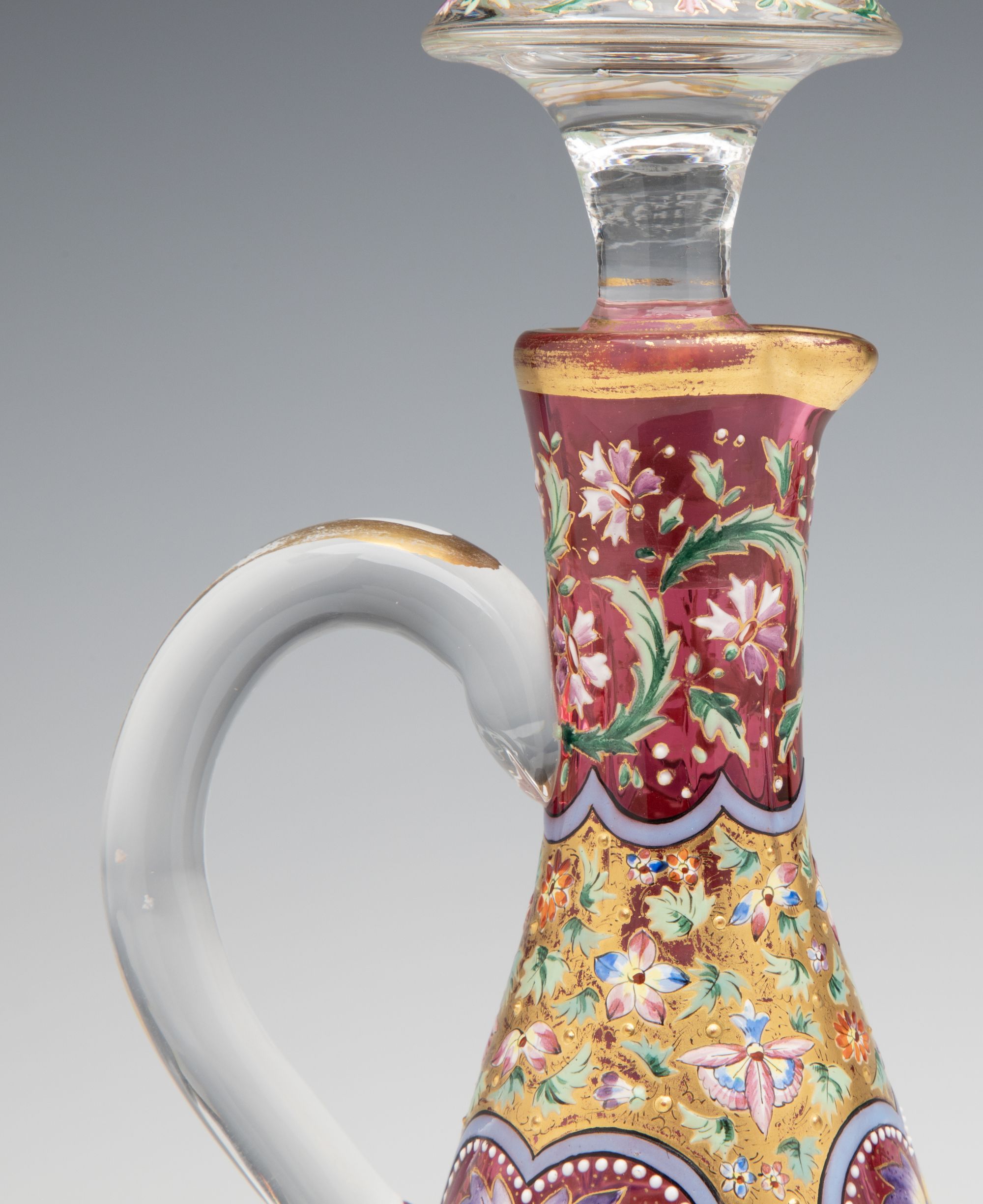 A LAVISHLY DECORATED CRANBERRY GLASS CRUET ATTR MOSER