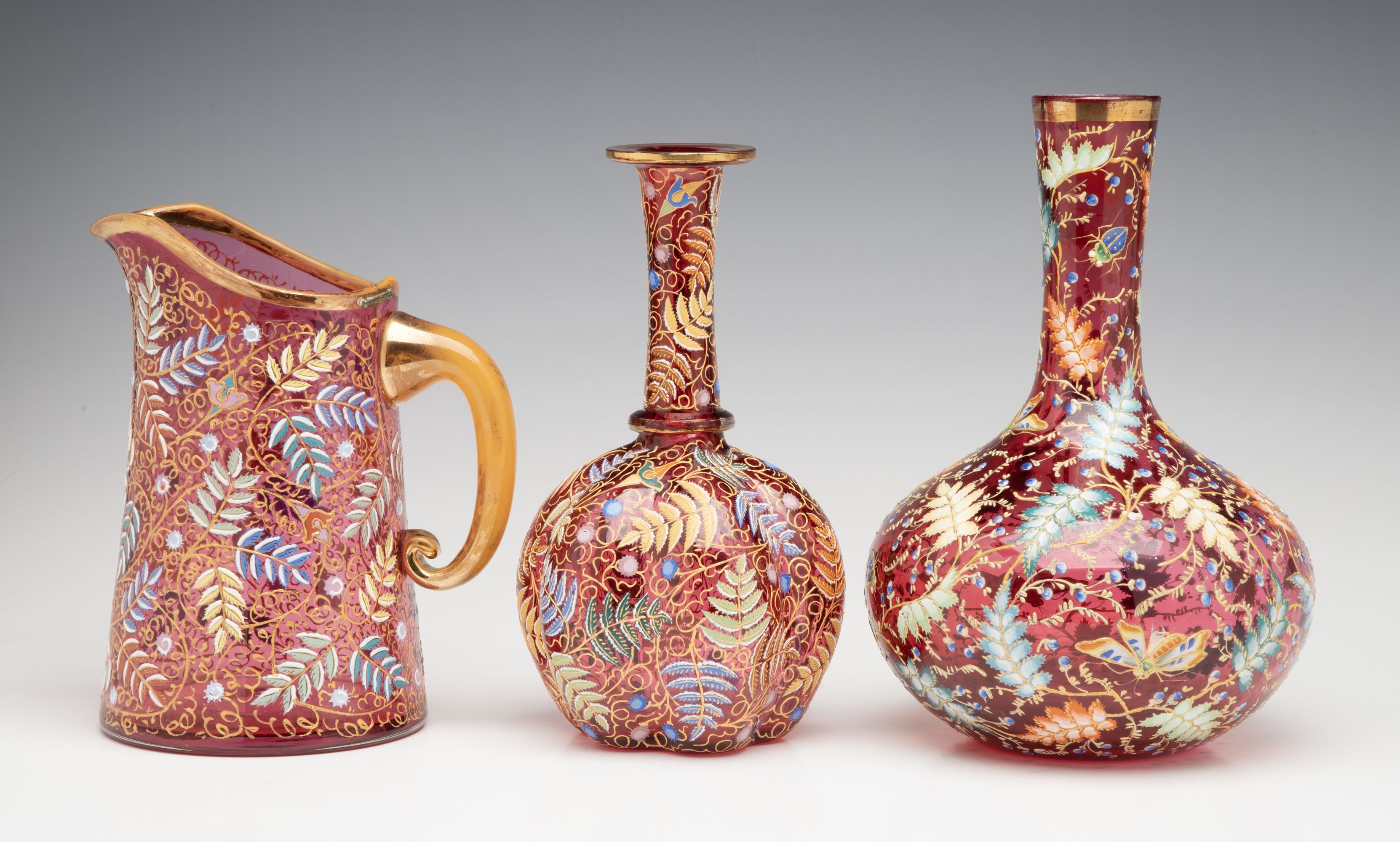 A GROUPING OF GILT AND ENAMEL DECORATED MOSER ART GLASS