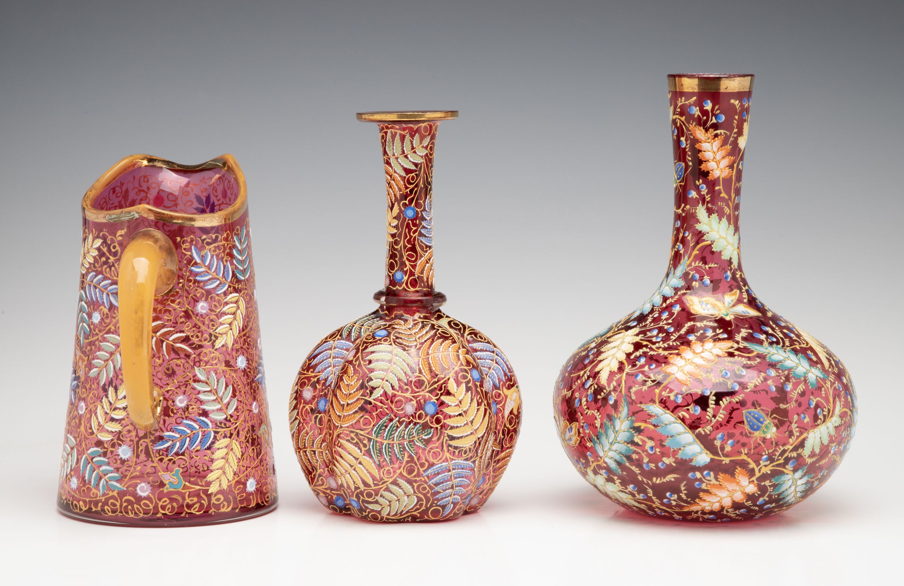 A GROUPING OF GILT AND ENAMEL DECORATED MOSER ART GLASS