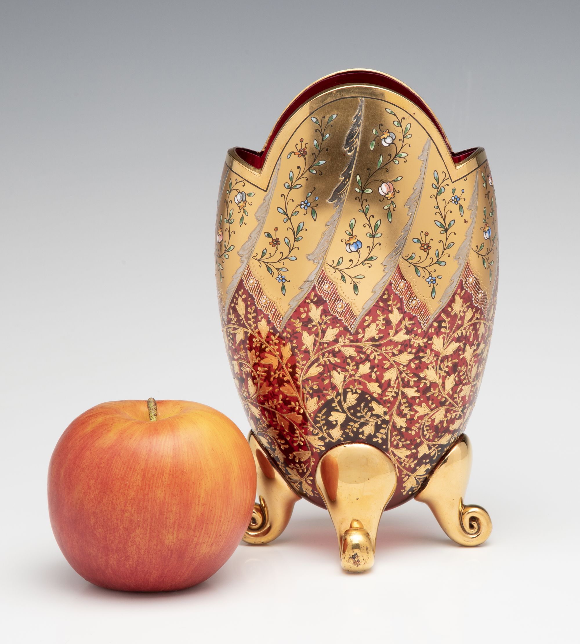 A VERY FINE MOSER GILT AND ENAMEL DEEP RUBY PILLOW VASE