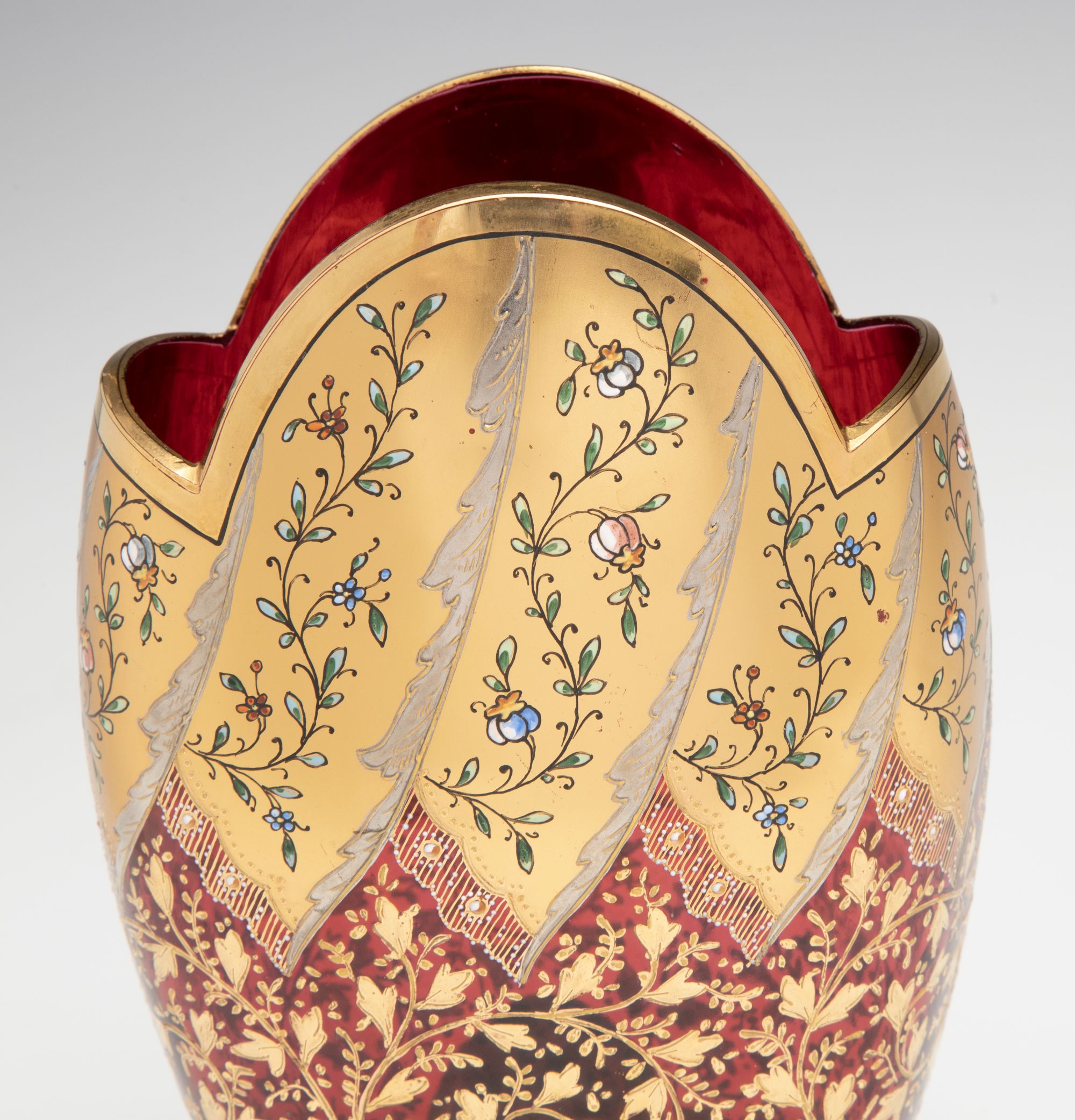 A VERY FINE MOSER GILT AND ENAMEL DEEP RUBY PILLOW VASE